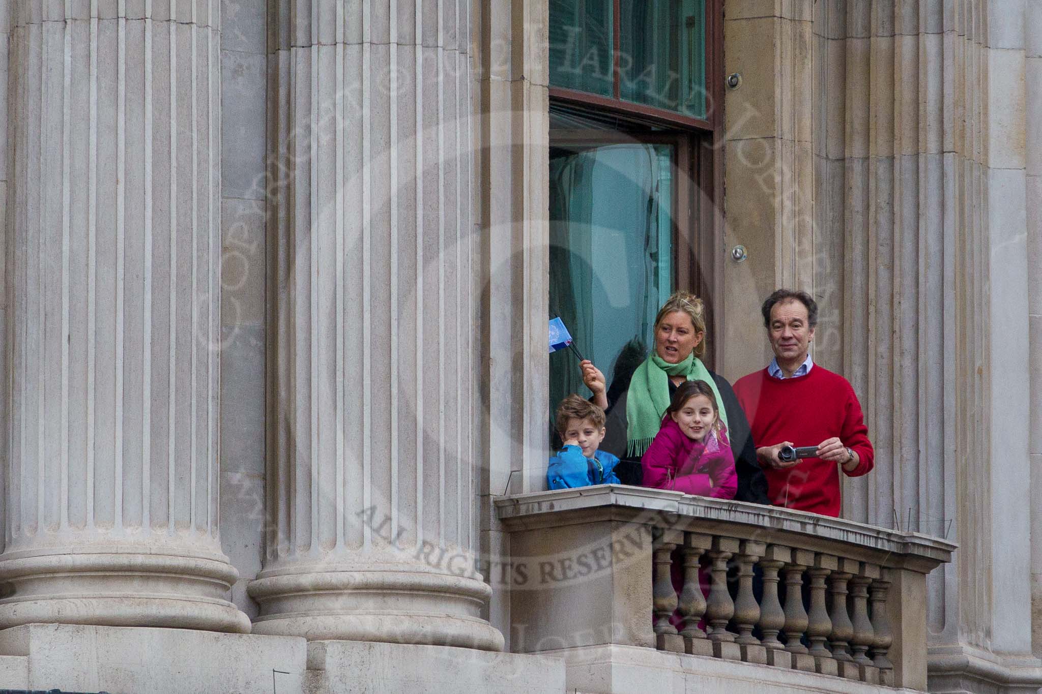 Lord Mayor's Show 2012: Spectators watching the event from a local balcony..
Press stand opposite Mansion House, City of London,
London,
Greater London,
United Kingdom,
on 10 November 2012 at 11:14, image #508