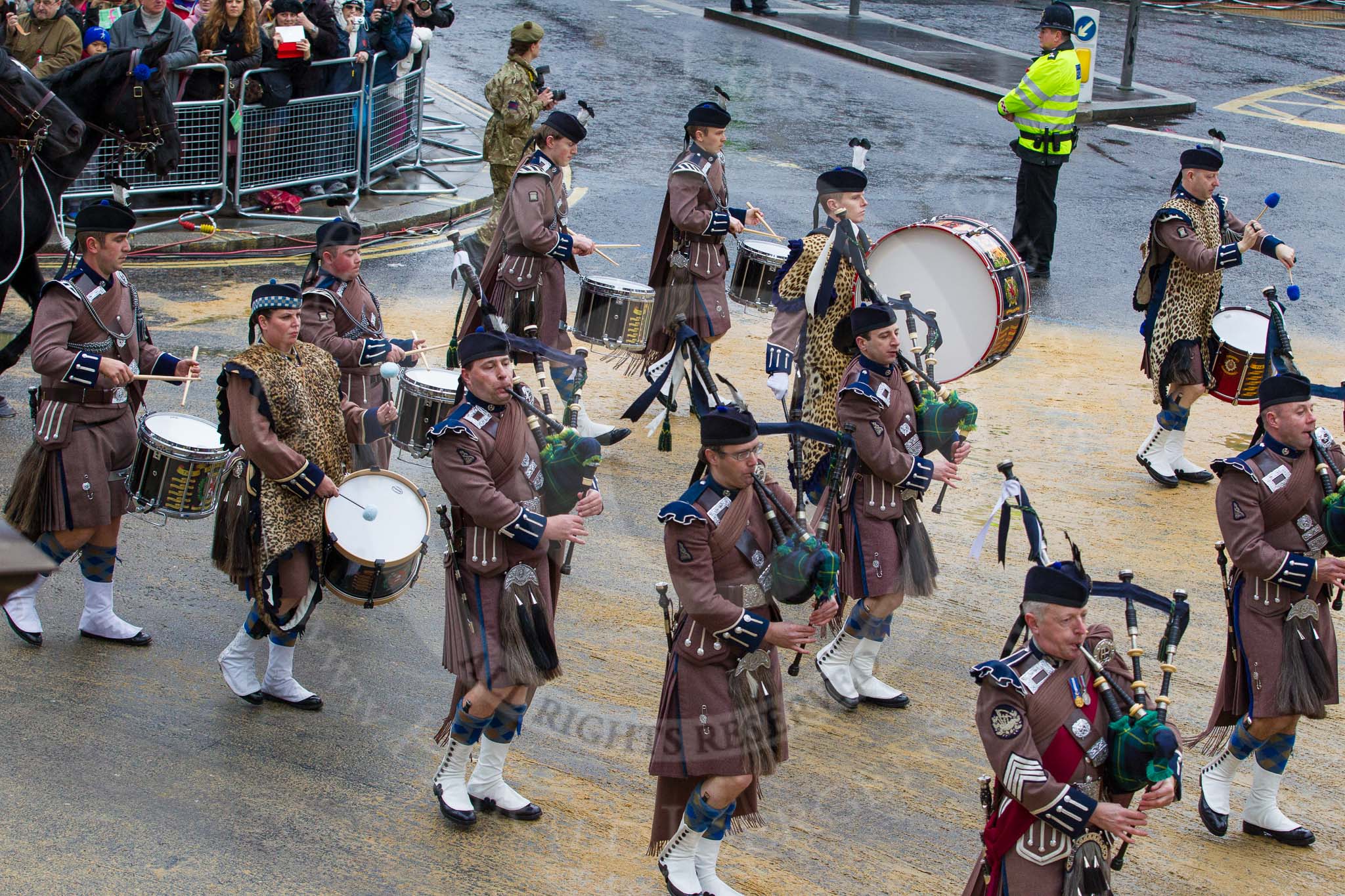 Lord Mayor's Show 2012: Entry 48 - The Pipes & Drums of the London Regiment, the only TA infantry battalion based in London..
Press stand opposite Mansion House, City of London,
London,
Greater London,
United Kingdom,
on 10 November 2012 at 11:21, image #656