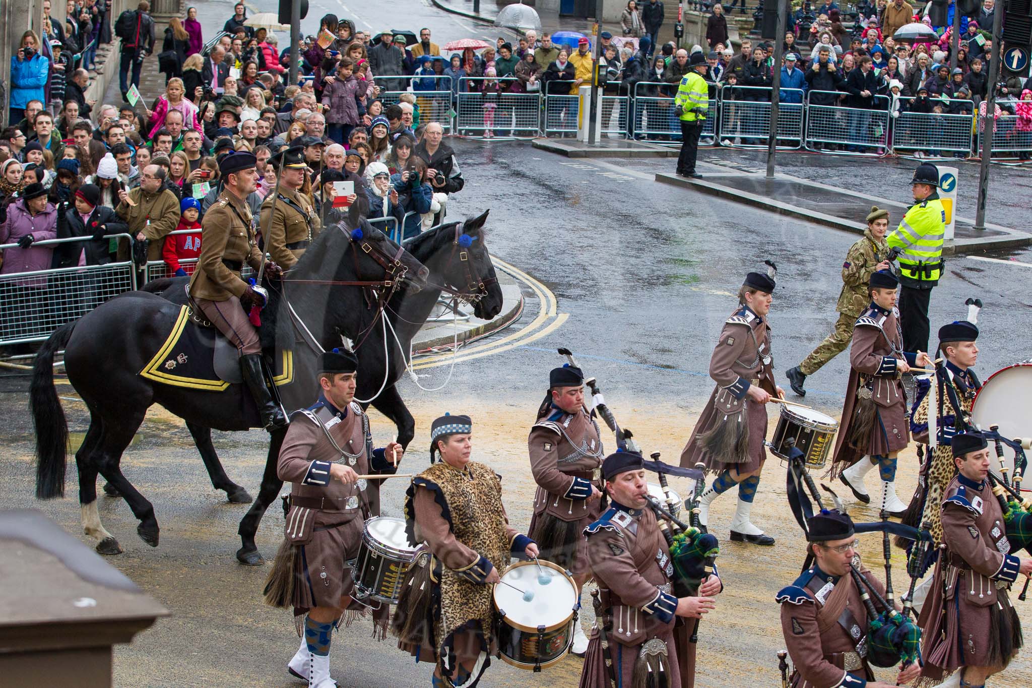 Lord Mayor's Show 2012: Entry 48 - The Pipes & Drums of the London Regiment, the only TA infantry battalion based in London..
Press stand opposite Mansion House, City of London,
London,
Greater London,
United Kingdom,
on 10 November 2012 at 11:21, image #658