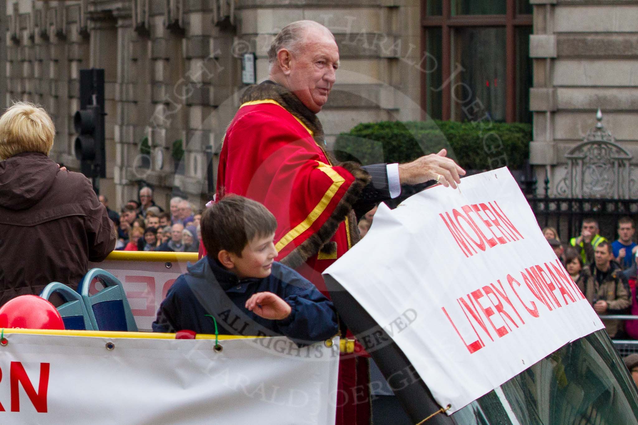 Lord Mayor's Show 2012: Entrry 104 - Modern Livery Companies, representing 26 Livery Companies..
Press stand opposite Mansion House, City of London,
London,
Greater London,
United Kingdom,
on 10 November 2012 at 11:50, image #1406