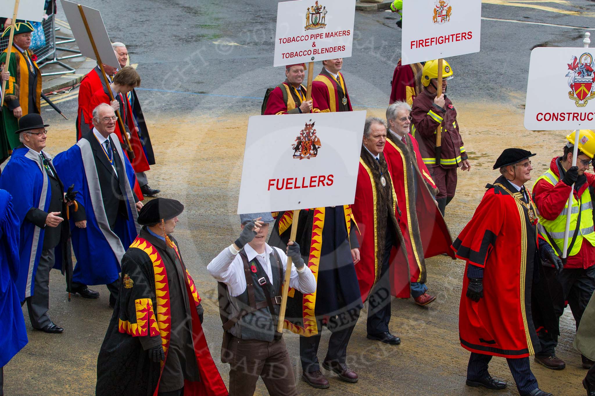 Lord Mayor's Show 2012: Entrry 104 - Modern Livery Companies, representing 26 Livery Companies..
Press stand opposite Mansion House, City of London,
London,
Greater London,
United Kingdom,
on 10 November 2012 at 11:51, image #1411