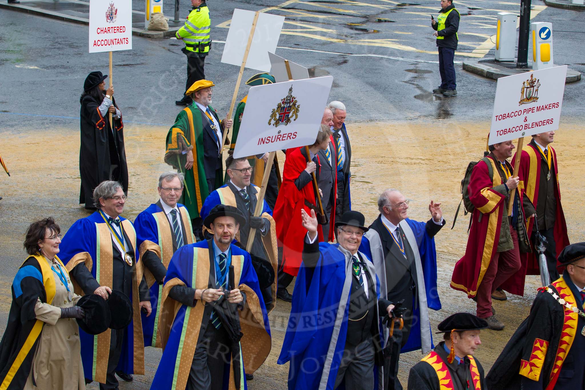 Lord Mayor's Show 2012: Entrry 104 - Modern Livery Companies, representing 26 Livery Companies..
Press stand opposite Mansion House, City of London,
London,
Greater London,
United Kingdom,
on 10 November 2012 at 11:51, image #1418