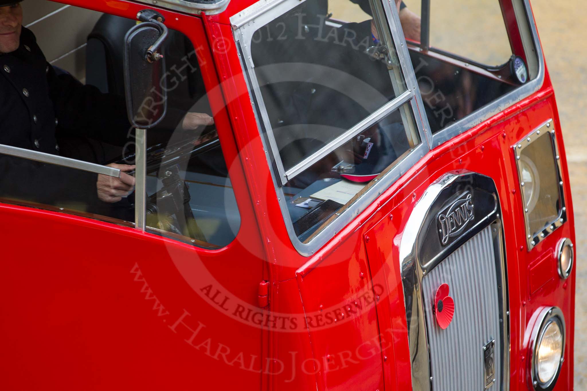 Lord Mayor's Show 2012: Entrry 104 - Modern Livery Companies, representing 26 Livery Companies, here with a historic Dennis fire engine..
Press stand opposite Mansion House, City of London,
London,
Greater London,
United Kingdom,
on 10 November 2012 at 11:52, image #1460