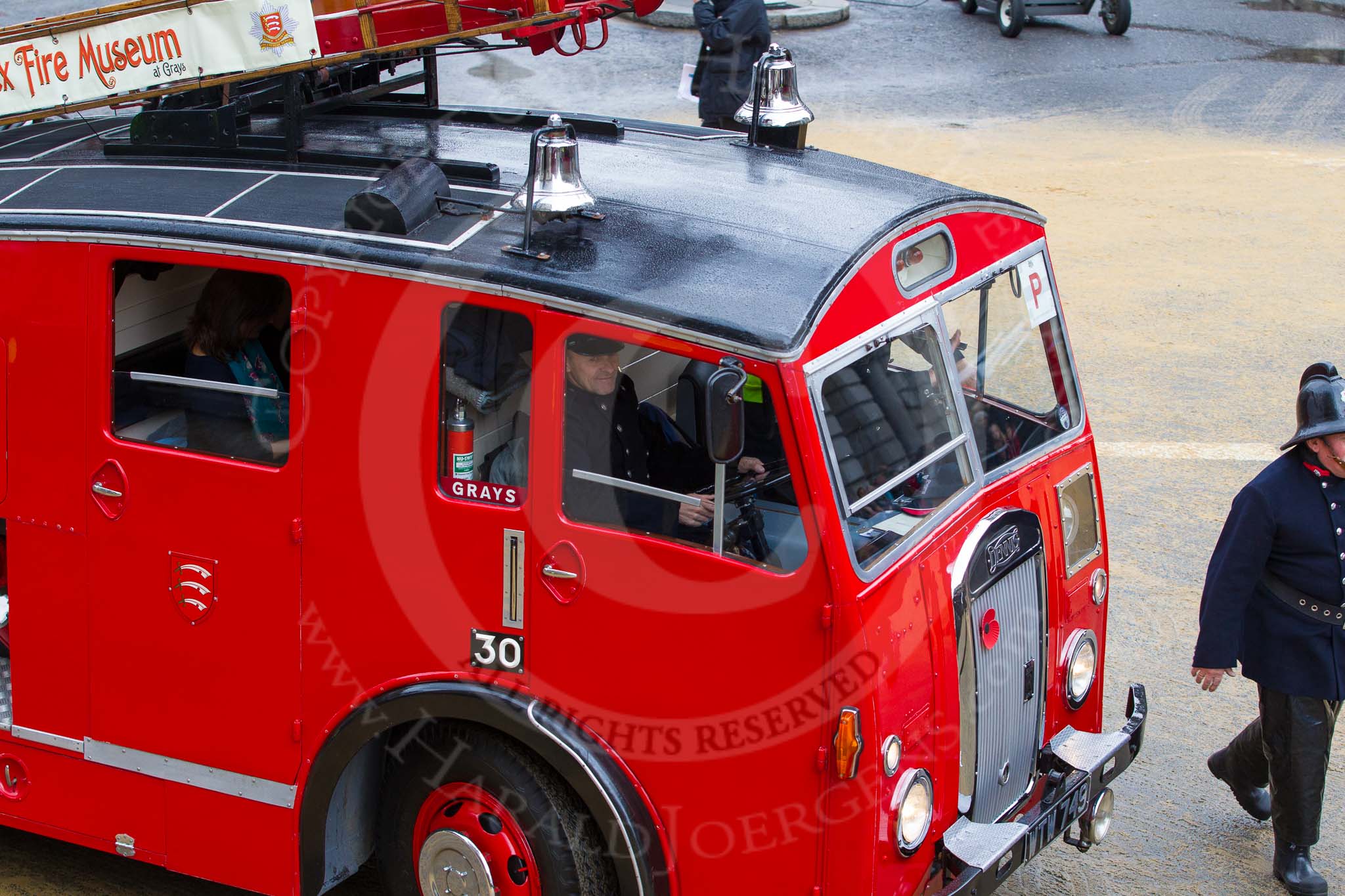 Lord Mayor's Show 2012: Entrry 104 - Modern Livery Companies, representing 26 Livery Companies, here with a historic Dennis fire engine..
Press stand opposite Mansion House, City of London,
London,
Greater London,
United Kingdom,
on 10 November 2012 at 11:52, image #1461