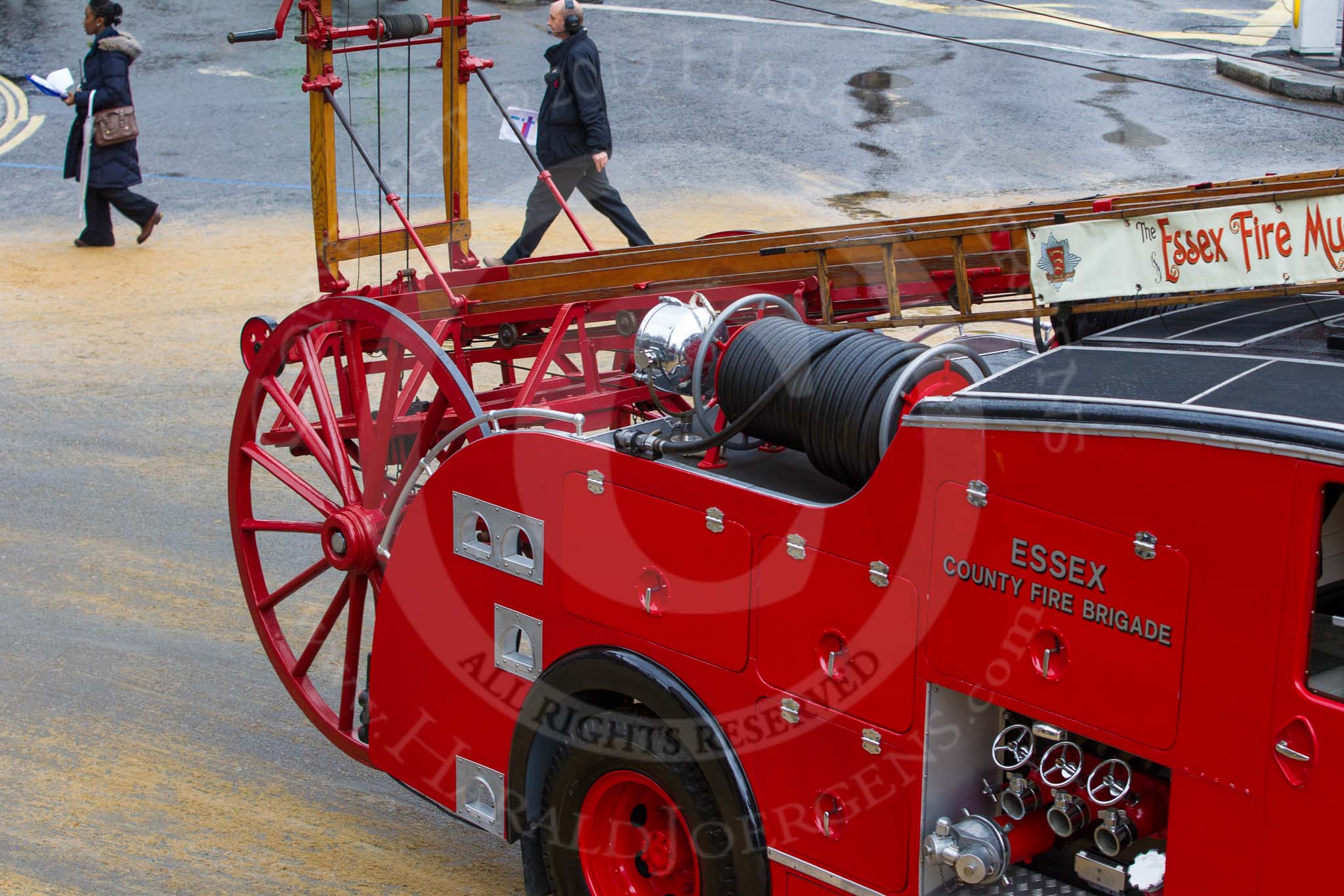 Lord Mayor's Show 2012: Entrry 104 - Modern Livery Companies, representing 26 Livery Companies, here with a historic (1950) Dennis fire engine from the Essex County Fire Brigade..
Press stand opposite Mansion House, City of London,
London,
Greater London,
United Kingdom,
on 10 November 2012 at 11:52, image #1464