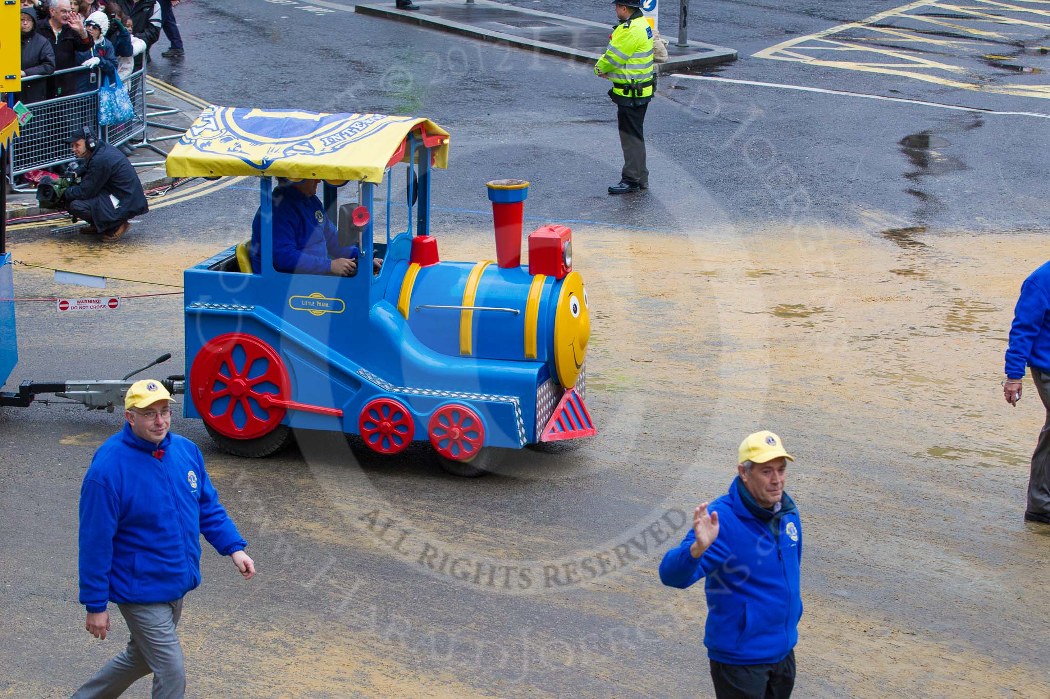 Lord Mayor's Show 2012: Entry 110 - Lions Clubs International..
Press stand opposite Mansion House, City of London,
London,
Greater London,
United Kingdom,
on 10 November 2012 at 11:55, image #1566