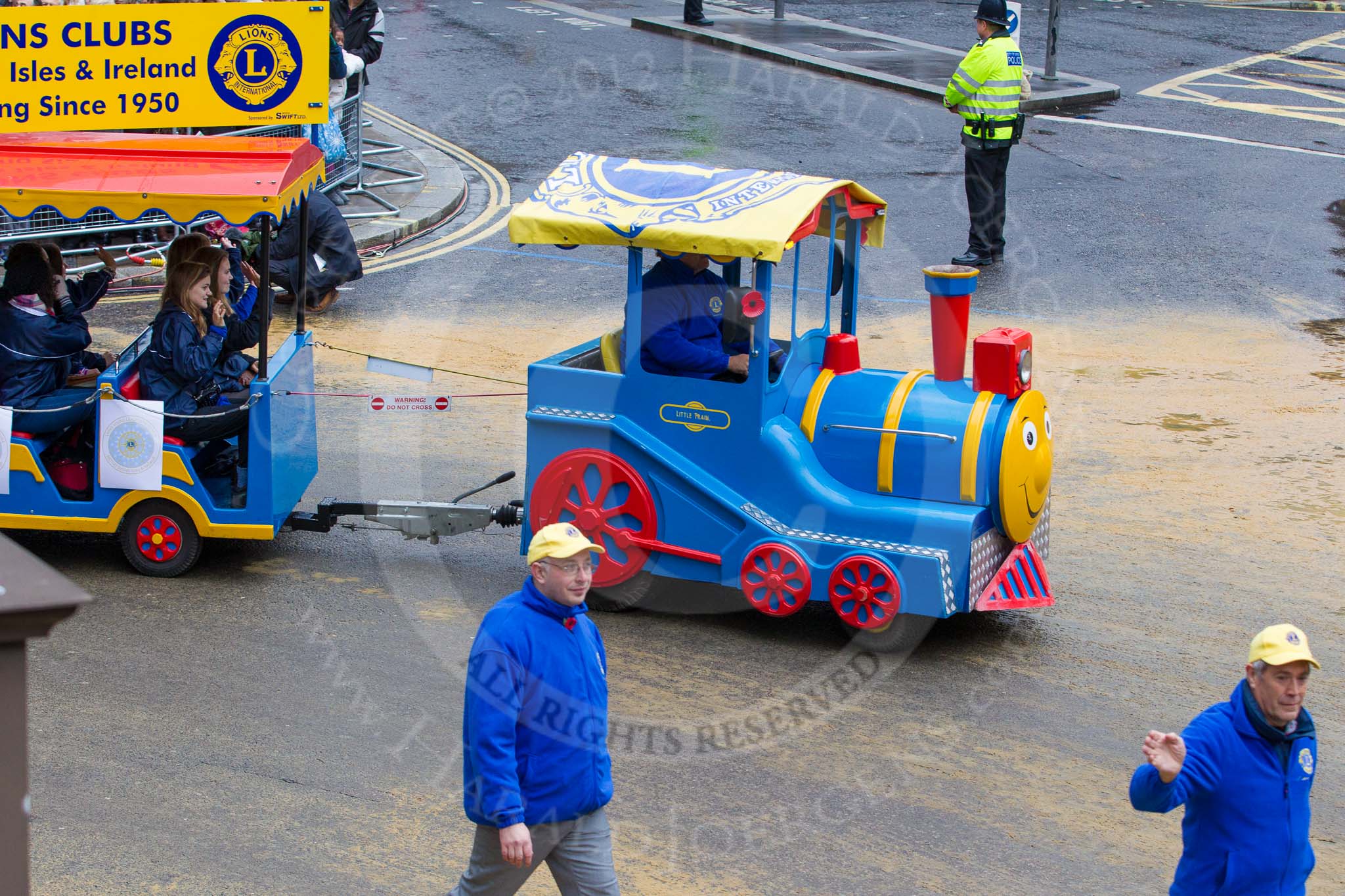 Lord Mayor's Show 2012: Entry 110 - Lions Clubs International..
Press stand opposite Mansion House, City of London,
London,
Greater London,
United Kingdom,
on 10 November 2012 at 11:55, image #1567