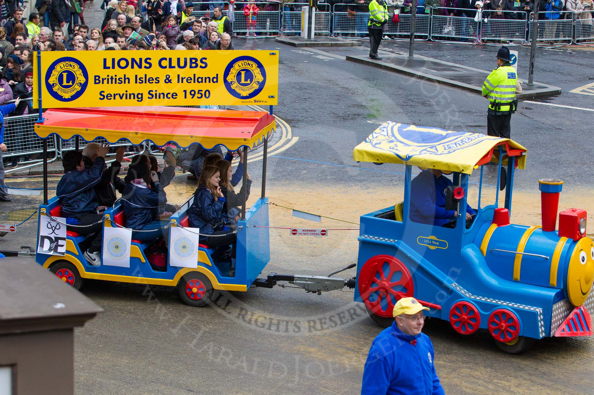 Lord Mayor's Show 2012: Entry 110 - Lions Clubs International..
Press stand opposite Mansion House, City of London,
London,
Greater London,
United Kingdom,
on 10 November 2012 at 11:55, image #1568