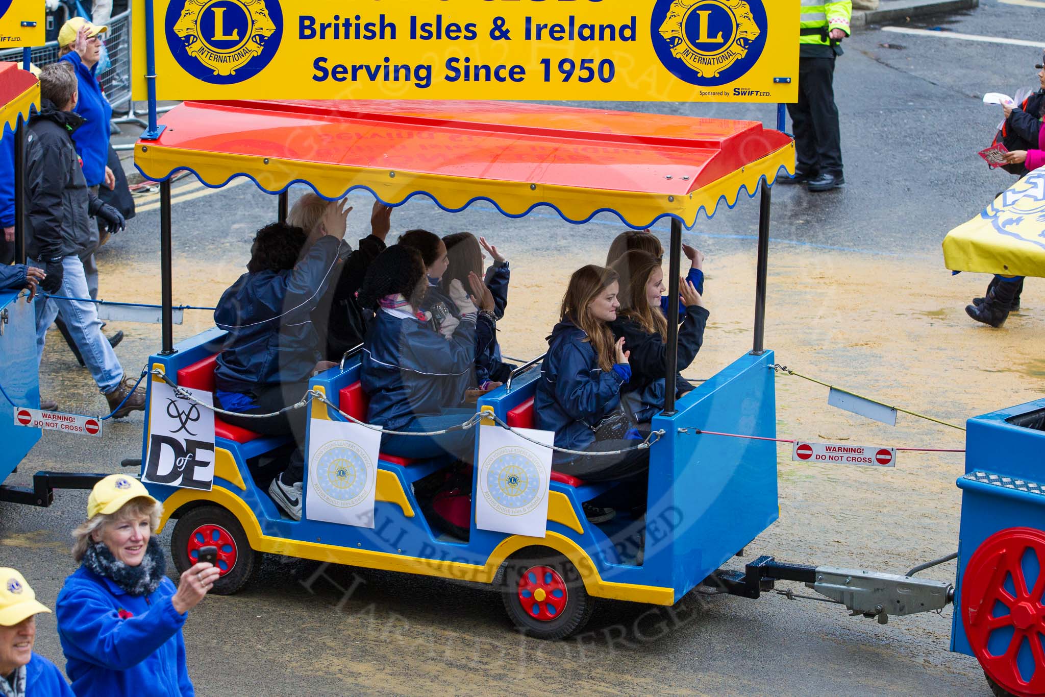 Lord Mayor's Show 2012: Entry 110 - Lions Clubs International..
Press stand opposite Mansion House, City of London,
London,
Greater London,
United Kingdom,
on 10 November 2012 at 11:55, image #1570