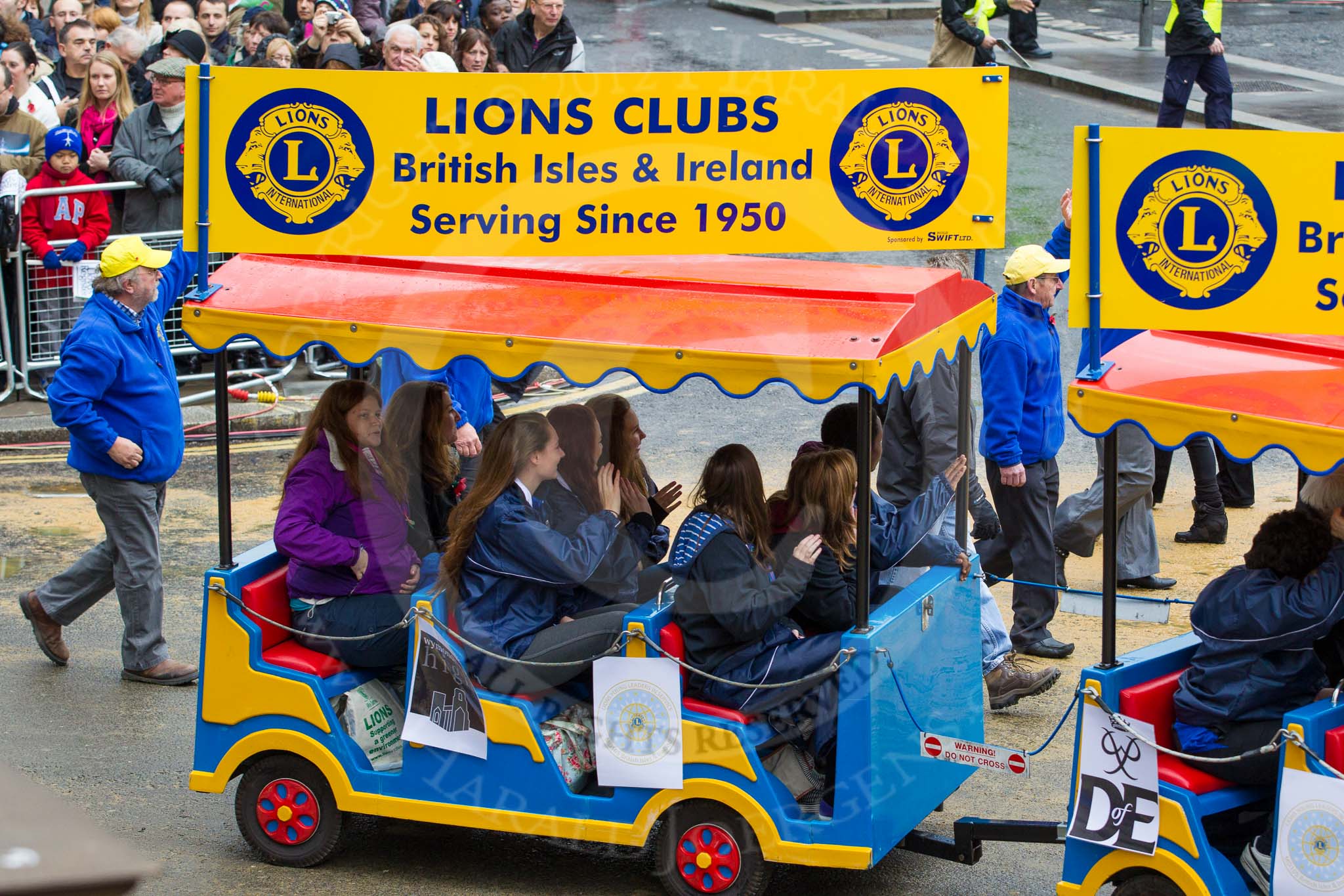 Lord Mayor's Show 2012: Entry 110 - Lions Clubs International..
Press stand opposite Mansion House, City of London,
London,
Greater London,
United Kingdom,
on 10 November 2012 at 11:55, image #1572