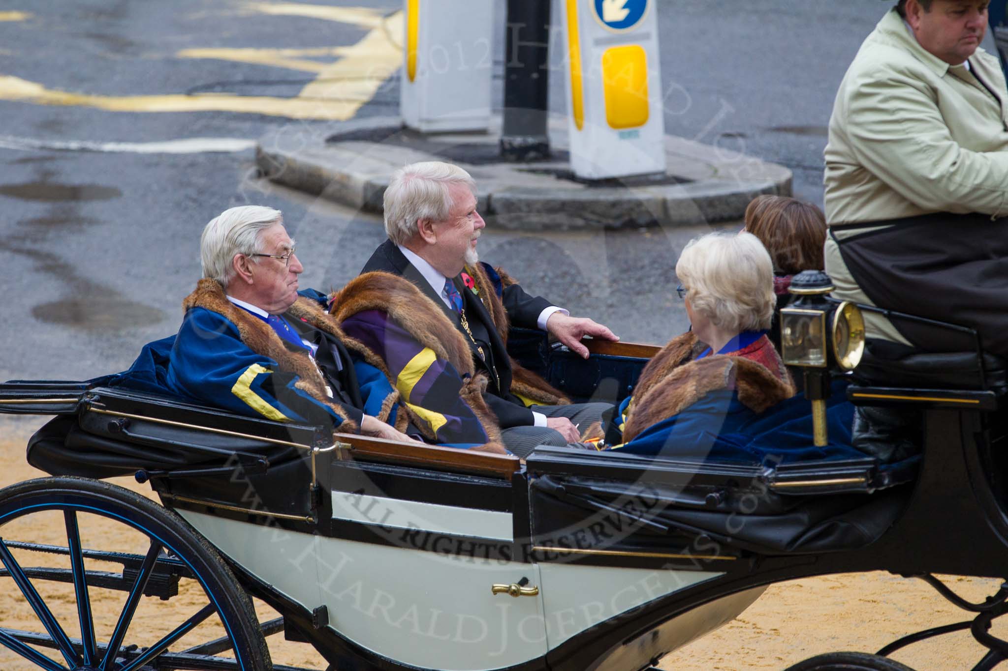 Lord Mayor's Show 2012: Entry 129 - Worshipful Company of Musicians, from left to right: Sir Anthony Cleaver (Senior Warden), Professor John Morehen (Master), Mrs Kathleen Duncan (Junior Warden), and Mrs Margaret Alford (Clerk)..
Press stand opposite Mansion House, City of London,
London,
Greater London,
United Kingdom,
on 10 November 2012 at 12:04, image #1838