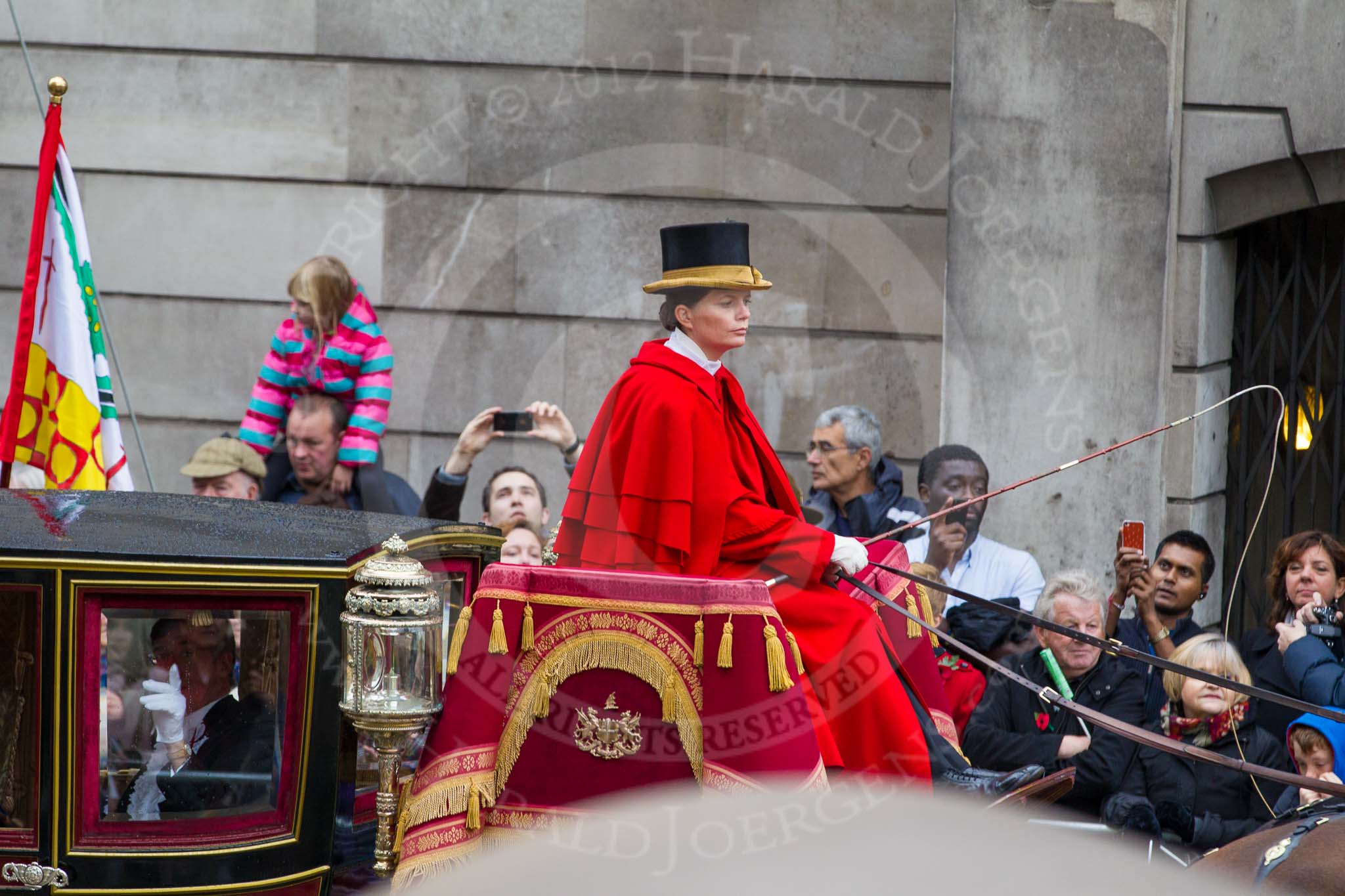 Lord Mayor's Show 2012: Entry 131- Chief Commoner and Secondary, with the Royal Mews's Lady Coachman Phillipa Jackson..
Press stand opposite Mansion House, City of London,
London,
Greater London,
United Kingdom,
on 10 November 2012 at 12:04, image #1841