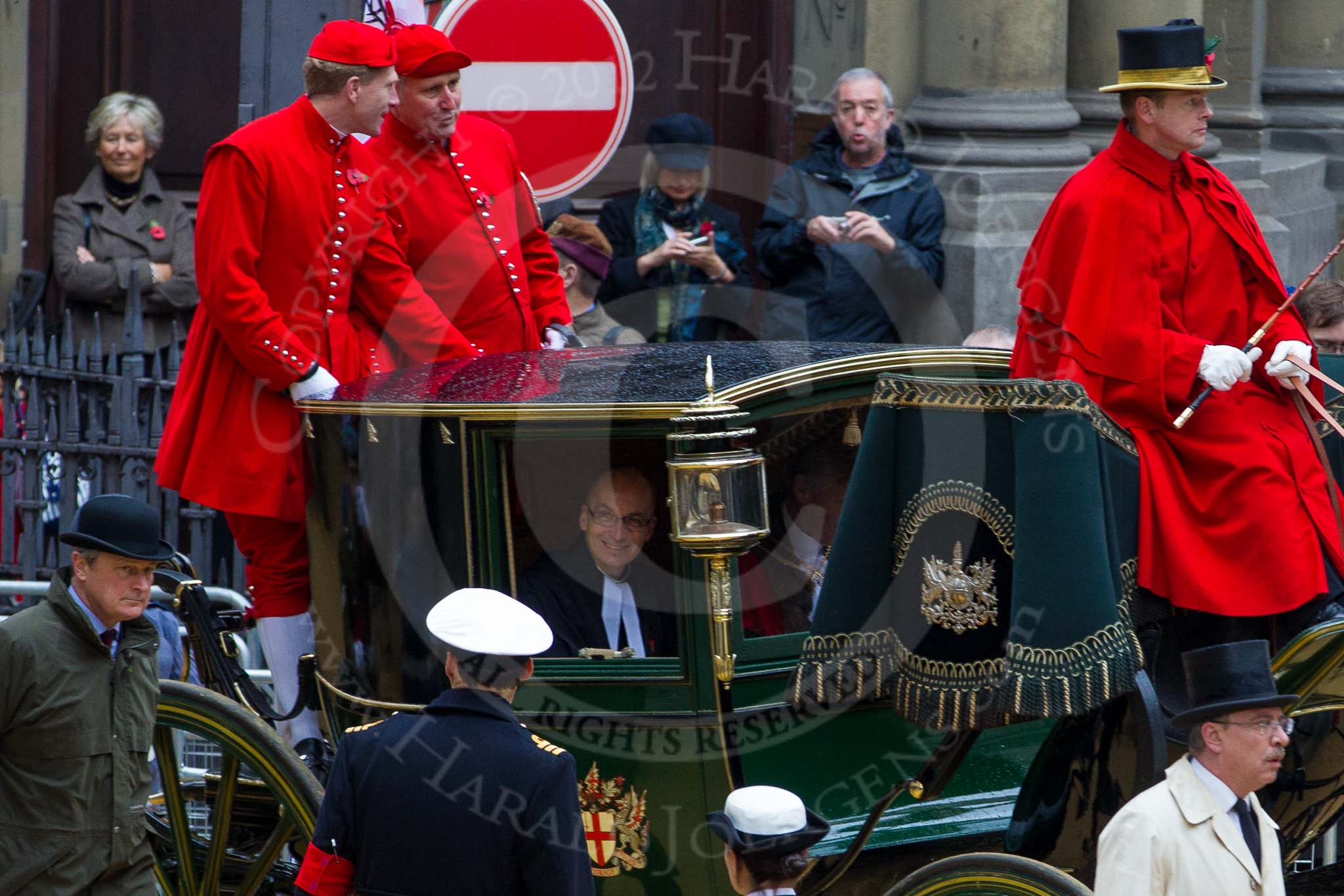 Lord Mayor's Show 2012: Entry 142 - Late Lord Mayor, Alderman and Mrs David Wootton, with the Chaplain Andrew Walker, escorted by four Yeoman Warders and cadets of 1475 (Dulwich) Squadron. Two Dogget's Coat and Badge men stand on the rear of the carriage..
Press stand opposite Mansion House, City of London,
London,
Greater London,
United Kingdom,
on 10 November 2012 at 12:07, image #1904