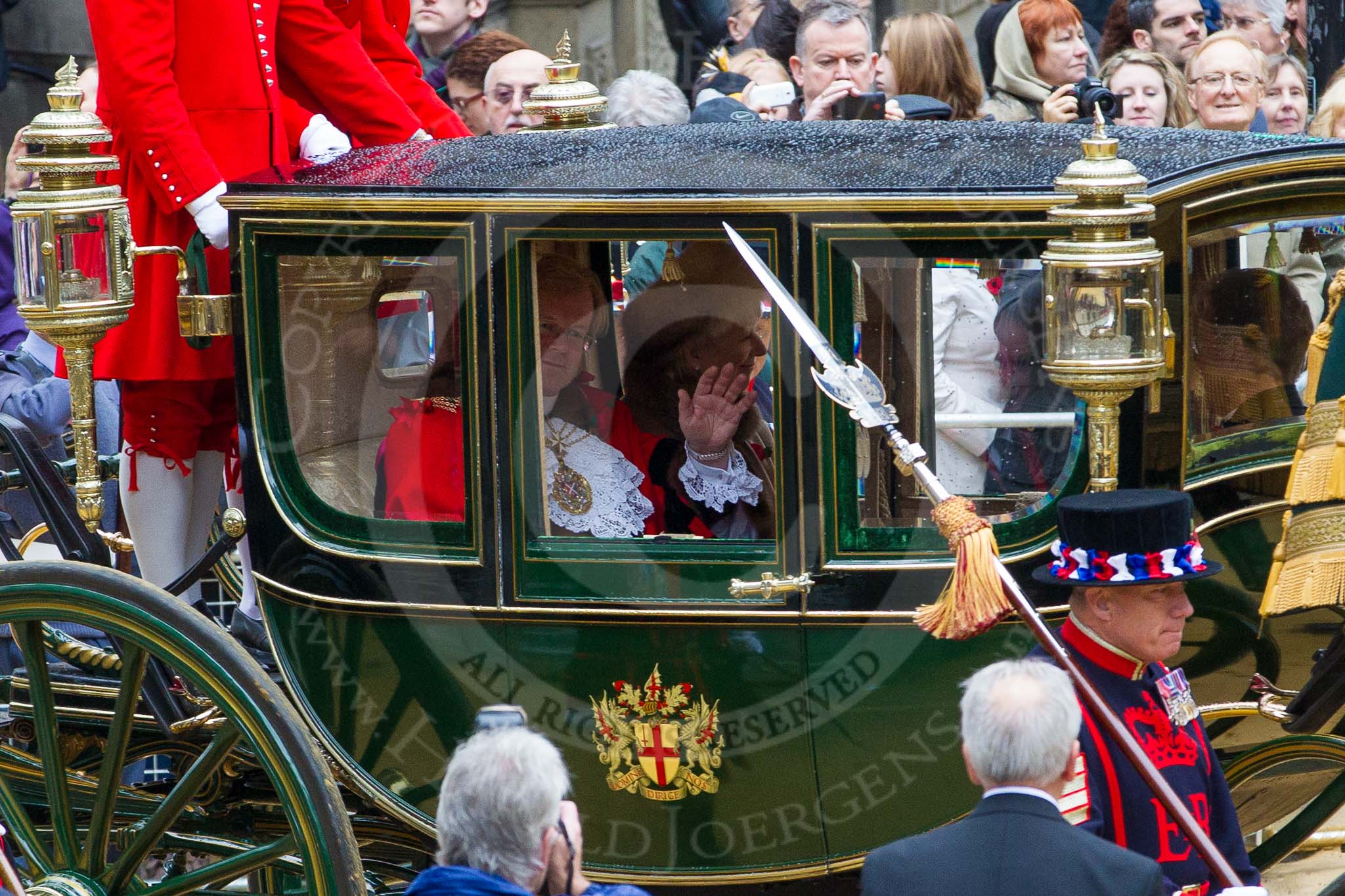 Photo 1211101208121D48434HaraldJoergens Lord Mayor's Show 2012: Entry 142 - Late Lord Mayor, Alderman and Mrs David Wootton, with the Chaplain Andrew Walker, escorted by four Yeoman Warders and cadets of 1475 (Dulwich) Squadron. Two Dogget's Coat and Badge men stand on the rear of the carriage..
Press stand opposite Mansion House, City of London,
London,
Greater London,
United Kingdom,
on 10 November 2012 at 12:08, image #1907