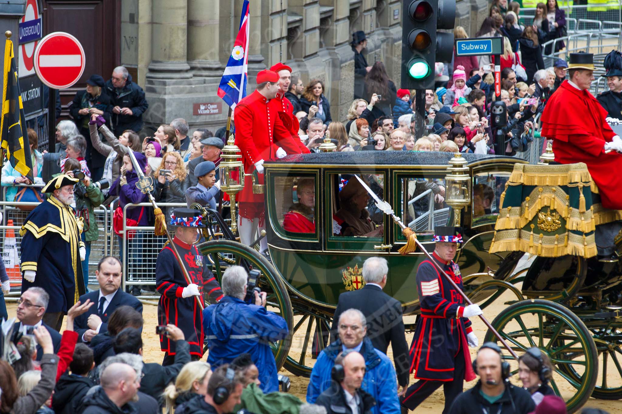 Lord Mayor's Show 2012: Entry 142 - Late Lord Mayor, Alderman and Mrs David Wootton, with the Chaplain Andrew Walker, escorted by four Yeoman Warders and cadets of 1475 (Dulwich) Squadron. Two Dogget's Coat and Badge men stand on the rear of the carriage..
Press stand opposite Mansion House, City of London,
London,
Greater London,
United Kingdom,
on 10 November 2012 at 12:08, image #1908