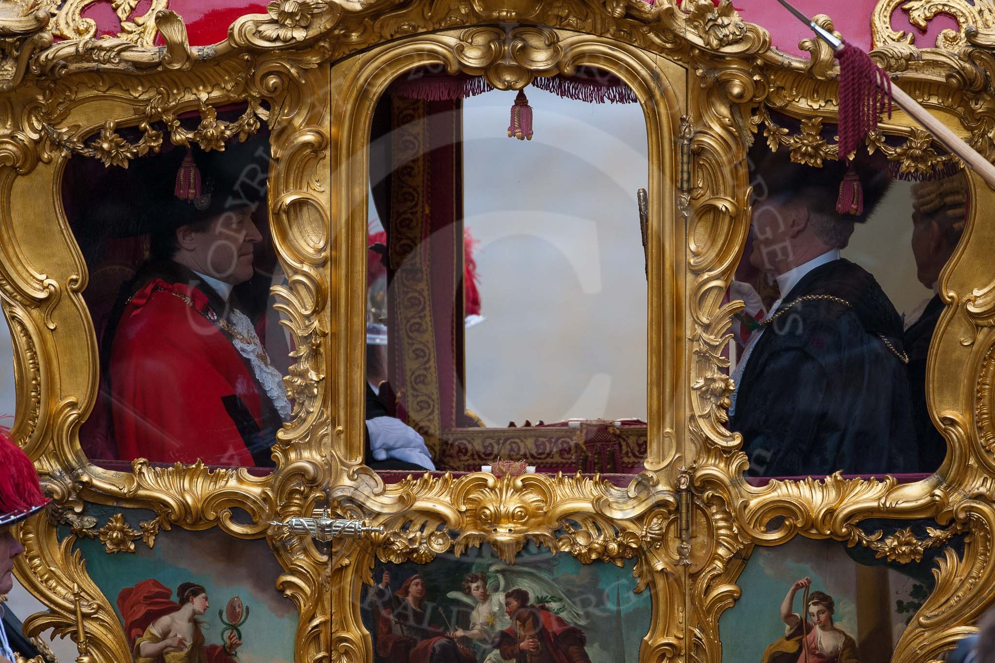 Lord Mayor's Show 2012: The new Lord Mayor, Roger Gifford, on his left the Chaplin, opposite the Sergeant of Arms and the Sword Bearer, Col. Richard Martin, in the State Coach, leaving for St Paul's Cathedral..
Press stand opposite Mansion House, City of London,
London,
Greater London,
United Kingdom,
on 10 November 2012 at 12:12, image #1941
