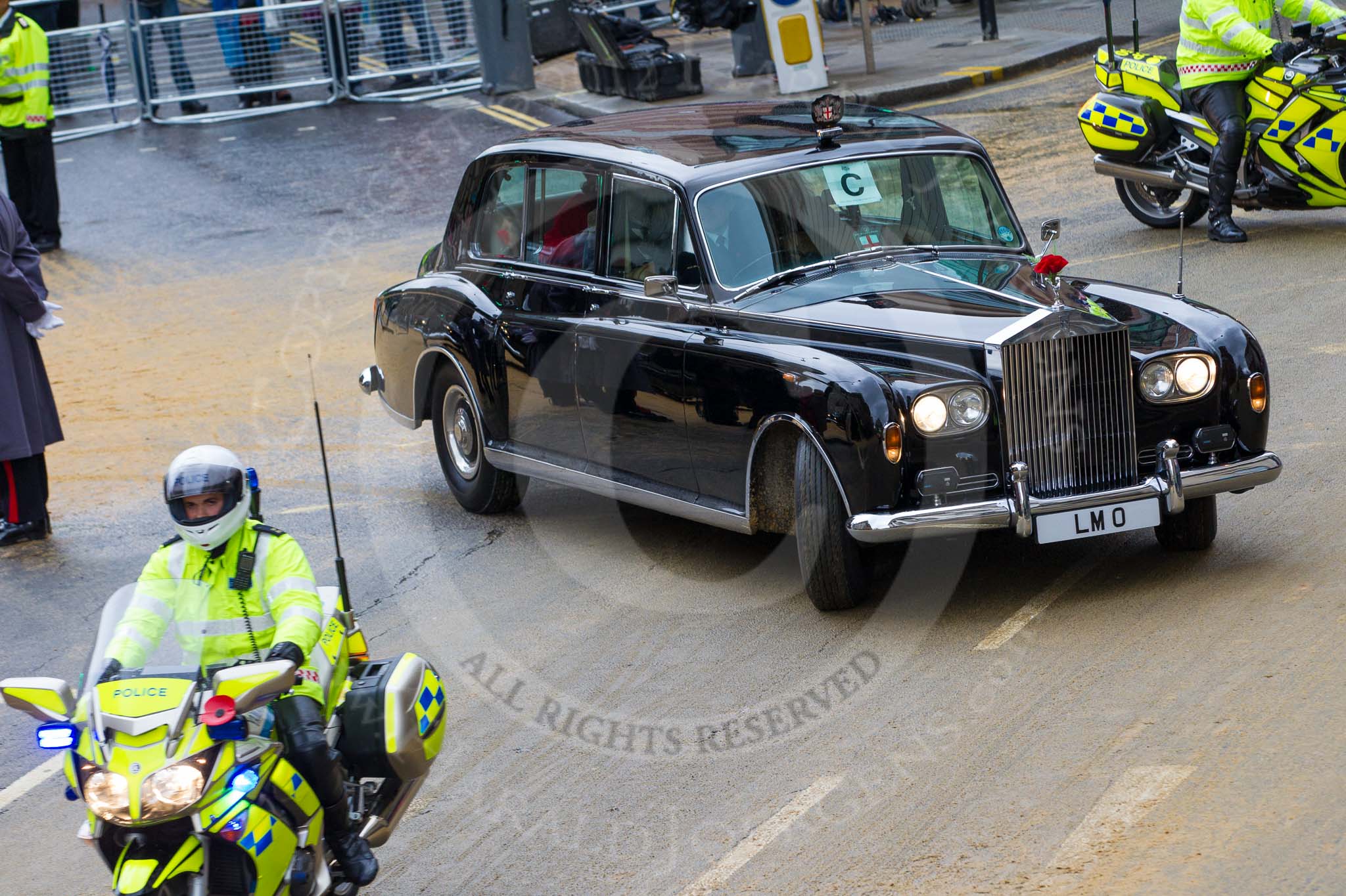 Lord Mayor's Show 2012: The Rolls Royce, registration LMO, leaving with a police escort..
Press stand opposite Mansion House, City of London,
London,
Greater London,
United Kingdom,
on 10 November 2012 at 12:15, image #1959