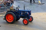Lord Mayor's Show 2012: Entrry 104 - Modern Livery Companies, representing 26 Livery Companies, here the farmers with  1950 Fordson Major tractor..
Press stand opposite Mansion House, City of London,
London,
Greater London,
United Kingdom,
on 10 November 2012 at 11:52, image #1450