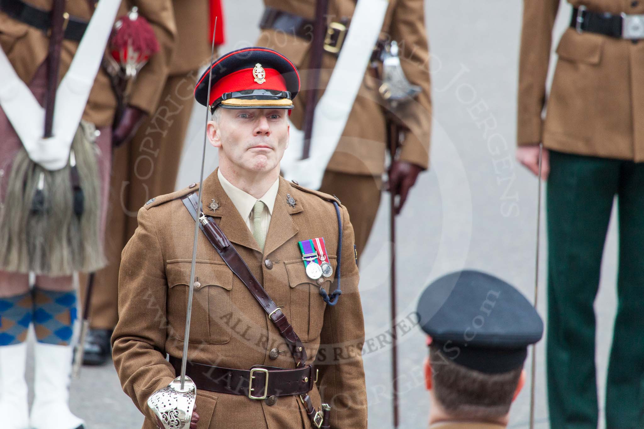 Lord Mayor's Show 2013: The London Regiment, Guard of Honour for the Lord Mayor: Major Ian Buchanan..
Press stand opposite Mansion House, City of London,
London,
Greater London,
United Kingdom,
on 09 November 2013 at 10:26, image #63