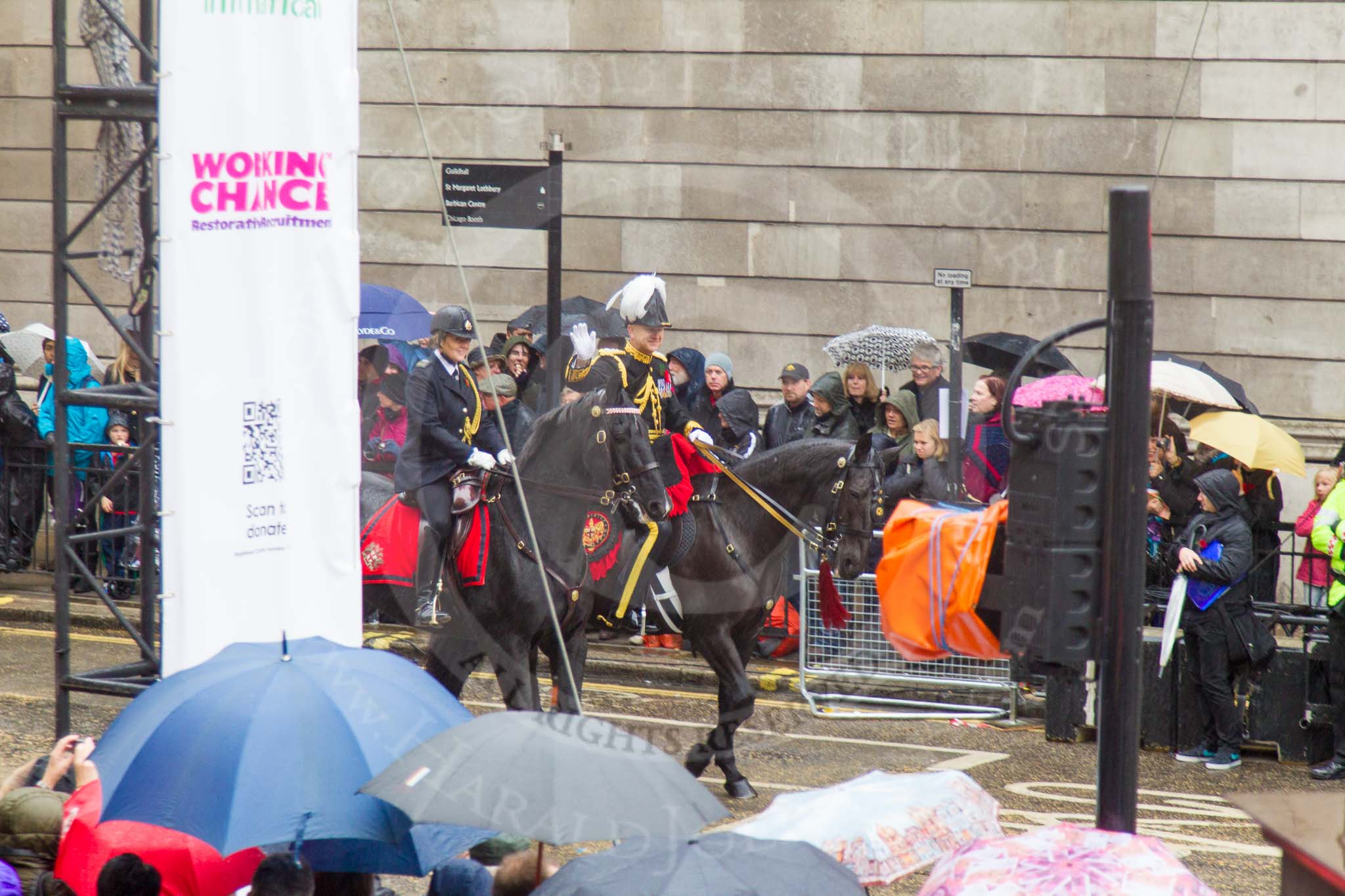 Lord Mayor's Show 2013: Rebecca Jenkins, senior Police Staff Trainer within the City of London Police mounted branch, and Adrian Leppard, Commissioner of the City of London Police, arrive at Mansion House as the sky opens..
Press stand opposite Mansion House, City of London,
London,
Greater London,
United Kingdom,
on 09 November 2013 at 10:47, image #81