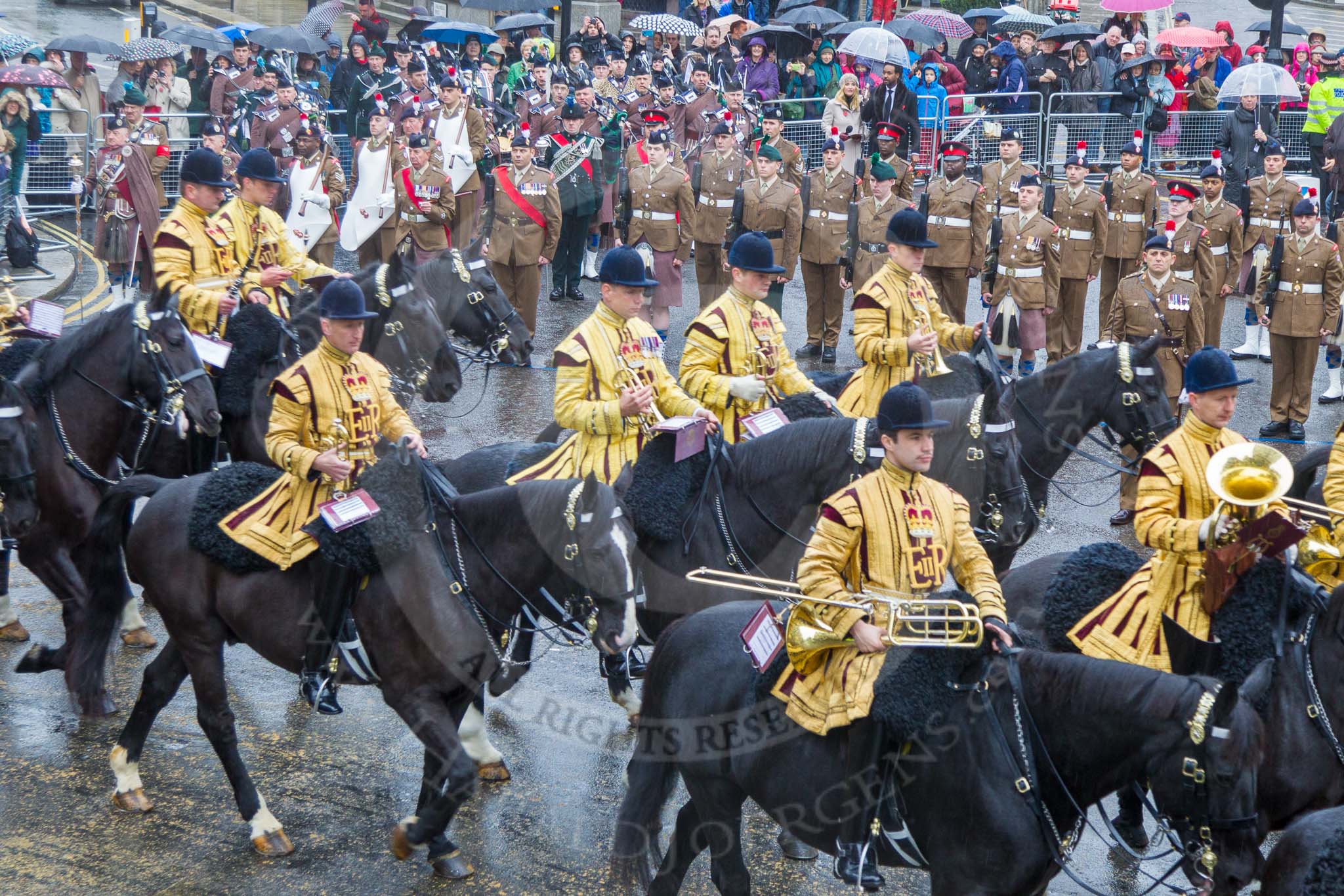 Lord Mayor's Show 2013: The Mounted Band of the Household Cavalry. Behind them The London Regiment, Guard of Honour for the Lord Mayor..
Press stand opposite Mansion House, City of London,
London,
Greater London,
United Kingdom,
on 09 November 2013 at 10:48, image #88