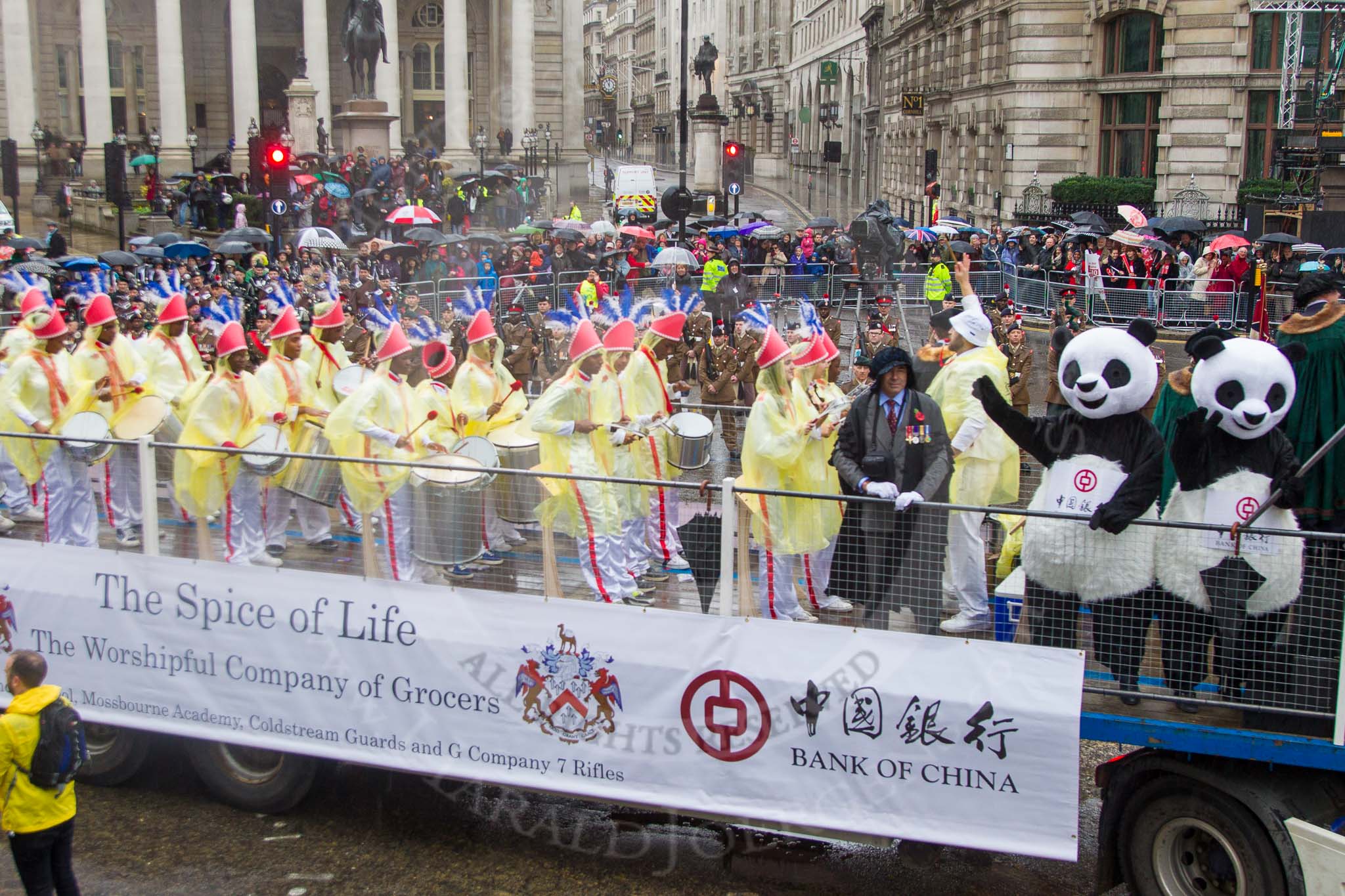 Lord Mayor's Show 2013: 6-Worshipful Company of Grocers- The Spice of Life, represented by the Coldstream Guards, G Company 7th Rifles and participants from Oundle School and Mossbourne Academy..
Press stand opposite Mansion House, City of London,
London,
Greater London,
United Kingdom,
on 09 November 2013 at 11:02, image #175