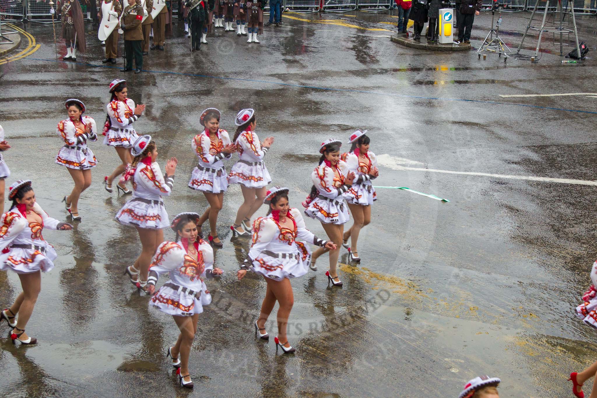 Lord Mayor's Show 2013: 20-Coporales San Simon Londres-community group that promotes Bolivian culture and folklore through performing traditional 'Caporales' dance..
Press stand opposite Mansion House, City of London,
London,
Greater London,
United Kingdom,
on 09 November 2013 at 11:10, image #317