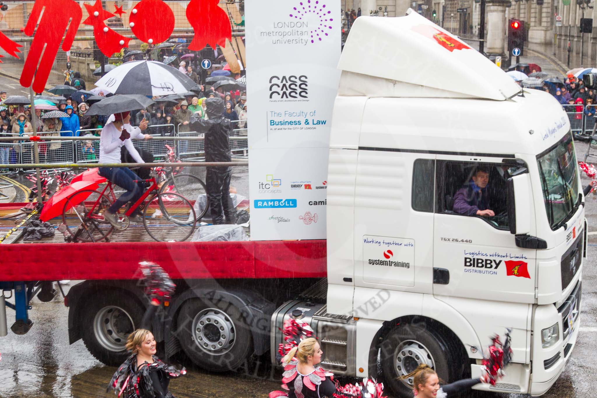 Lord Mayor's Show 2013: 54-London Metropolitan University-dynamic and multicultural institution which helps its students to build rewarding careers. Here they are presenting a heady mixture of architects, designers, lawyers and cheerleaders..
Press stand opposite Mansion House, City of London,
London,
Greater London,
United Kingdom,
on 09 November 2013 at 11:30, image #699