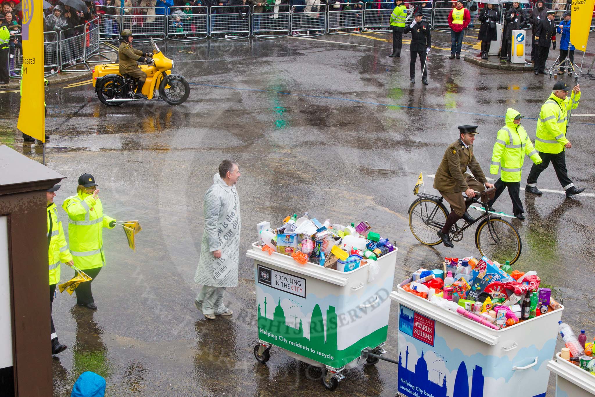 Lord Mayor's Show 2013: 59-Recycling in the City- The Binbot is joined again by his drumming street sweepers to celebrate 20th anniversary of the City's unique Clean City Awards scheme..
Press stand opposite Mansion House, City of London,
London,
Greater London,
United Kingdom,
on 09 November 2013 at 11:32, image #755