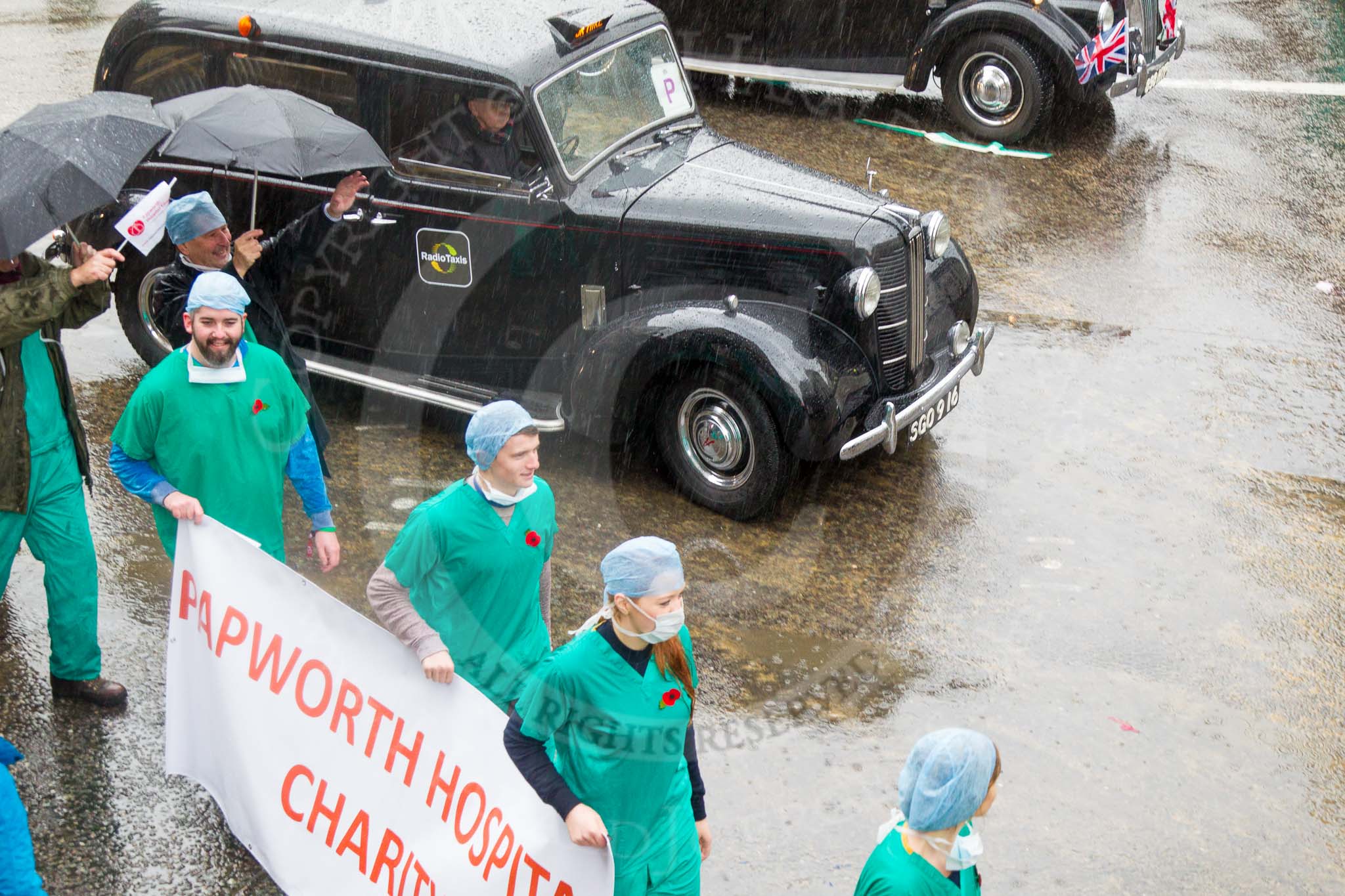 Lord Mayor's Show 2013: 69-Radio Taxis Group-today's entry celebrates 60 years of taxi history and supports the Papworth Heart Hospital..
Press stand opposite Mansion House, City of London,
London,
Greater London,
United Kingdom,
on 09 November 2013 at 11:37, image #840