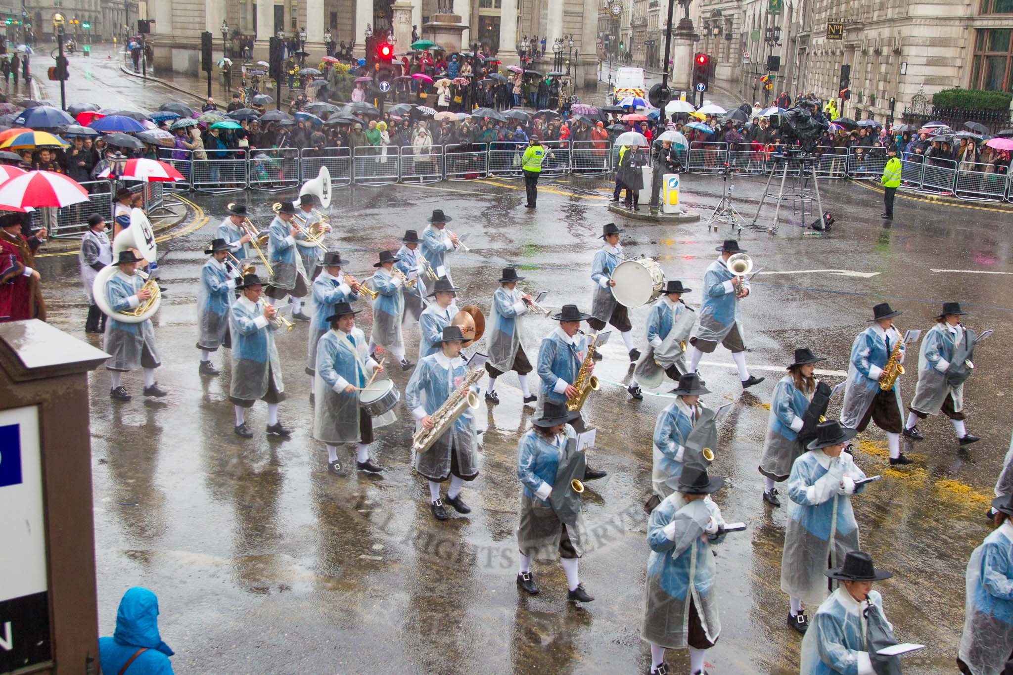 Lord Mayor's Show 2013: 81-Zunft Zur Zimmerleuten Band- the band traditionally supports the Zurich Swiss Gild of the Zimmerleuten in its parade and pageants, and is continuing that tradition today..
Press stand opposite Mansion House, City of London,
London,
Greater London,
United Kingdom,
on 09 November 2013 at 11:45, image #973