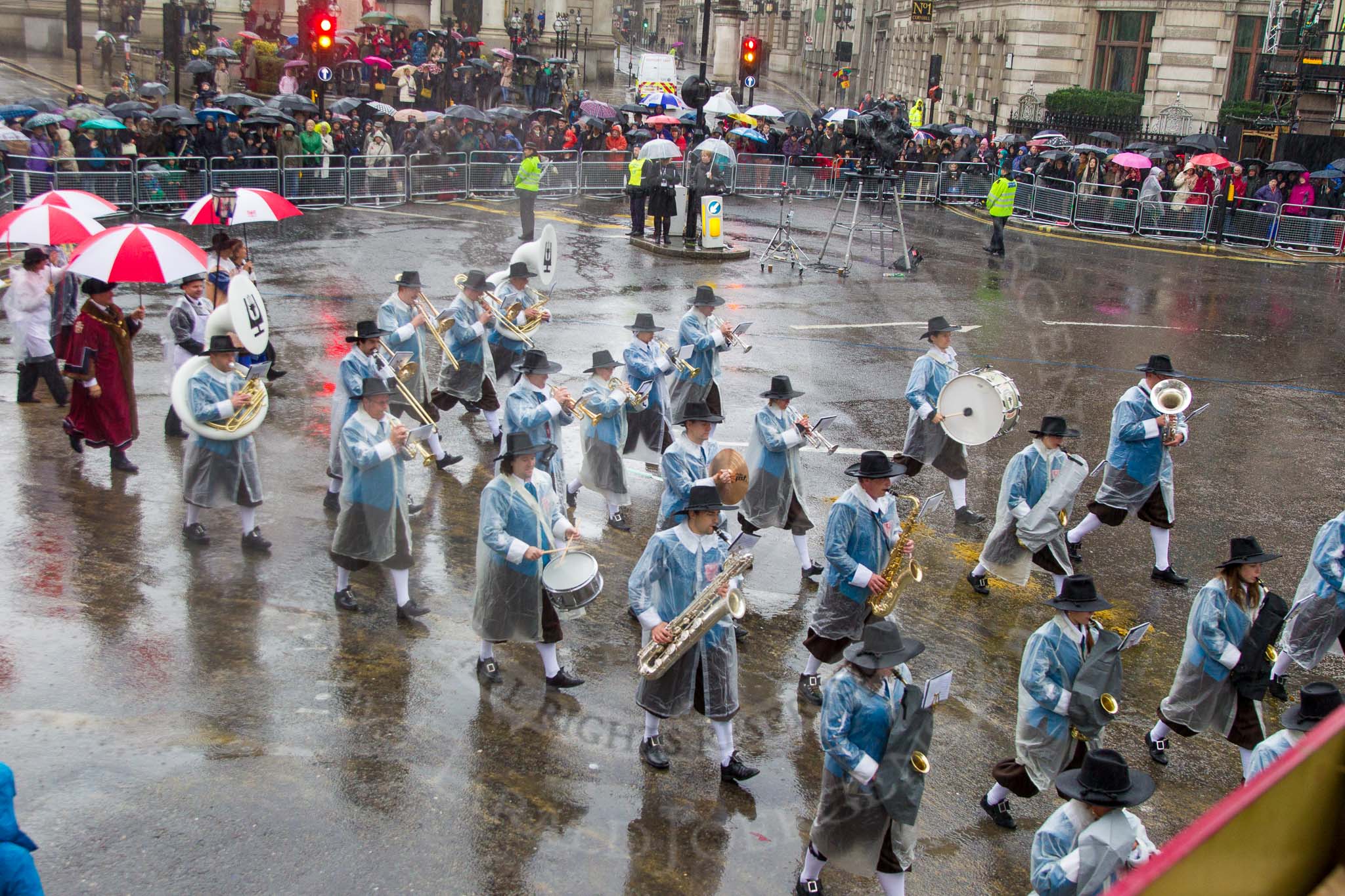 Lord Mayor's Show 2013: 81-Zunft Zur Zimmerleuten Band- the band traditionally supports the Zurich Swiss Gild of the Zimmerleuten in its parade and pageants, and is continuing that tradition today..
Press stand opposite Mansion House, City of London,
London,
Greater London,
United Kingdom,
on 09 November 2013 at 11:45, image #975