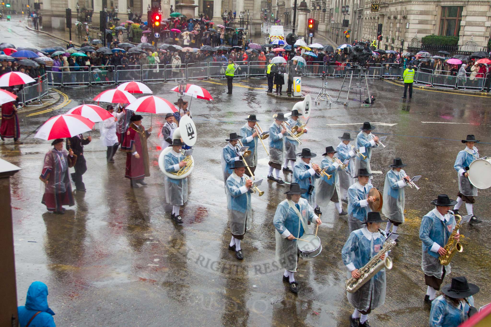 Lord Mayor's Show 2013: 81-Zunft Zur Zimmerleuten Band- the band traditionally supports the Zurich Swiss Gild of the Zimmerleuten in its parade and pageants, and is continuing that tradition today..
Press stand opposite Mansion House, City of London,
London,
Greater London,
United Kingdom,
on 09 November 2013 at 11:45, image #977
