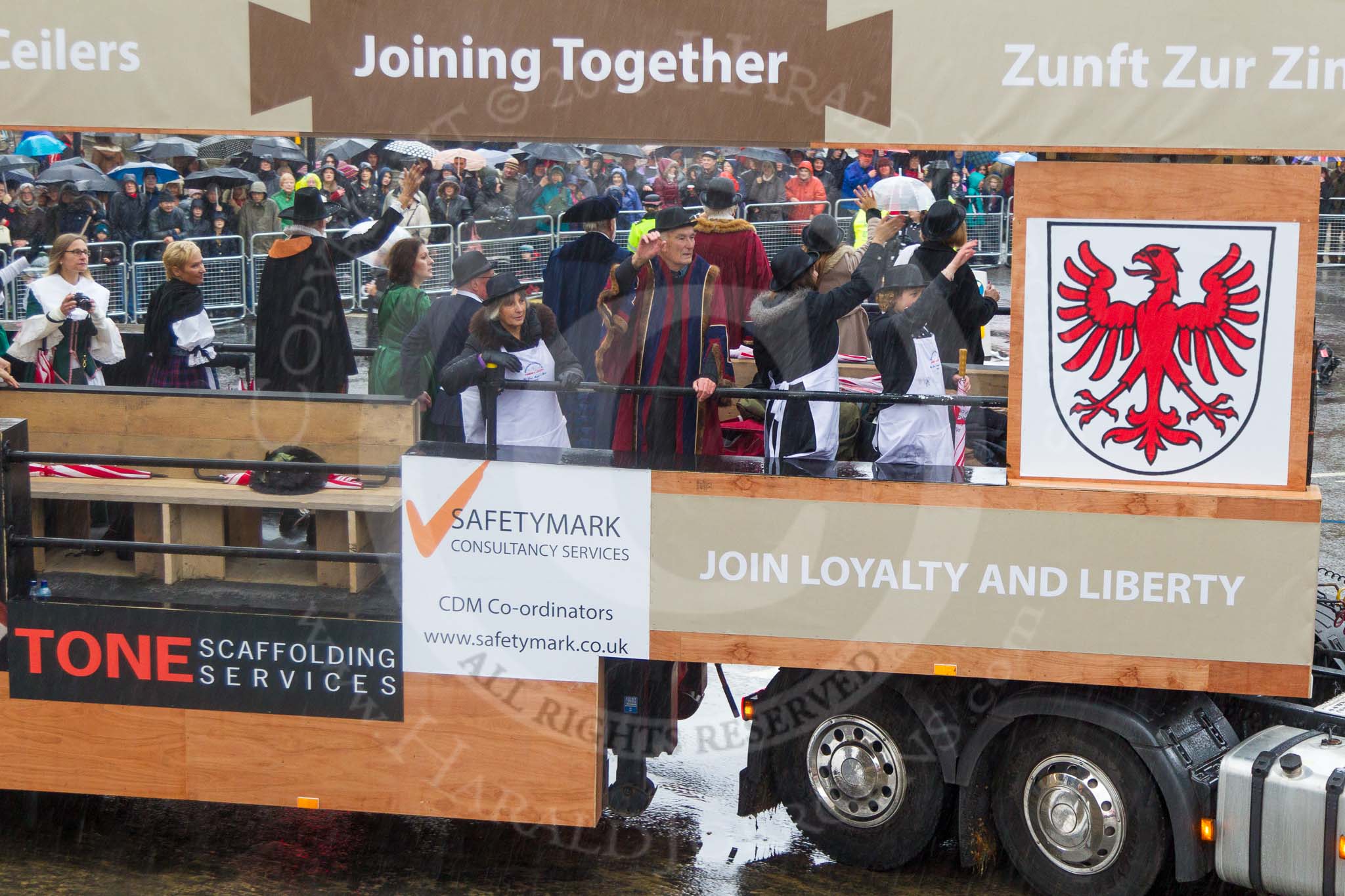 Lord Mayor's Show 2013: 82-Worshipful Company Of Joiners & Ceilers with Zunft Zur Zimmerleuten- the Joiners and Ceilers celebrates its long association with the Swiss Guild of the Zimmerleuten with a troop of horseman and latge contingnet of members in traditional costumes..
Press stand opposite Mansion House, City of London,
London,
Greater London,
United Kingdom,
on 09 November 2013 at 11:46, image #1002