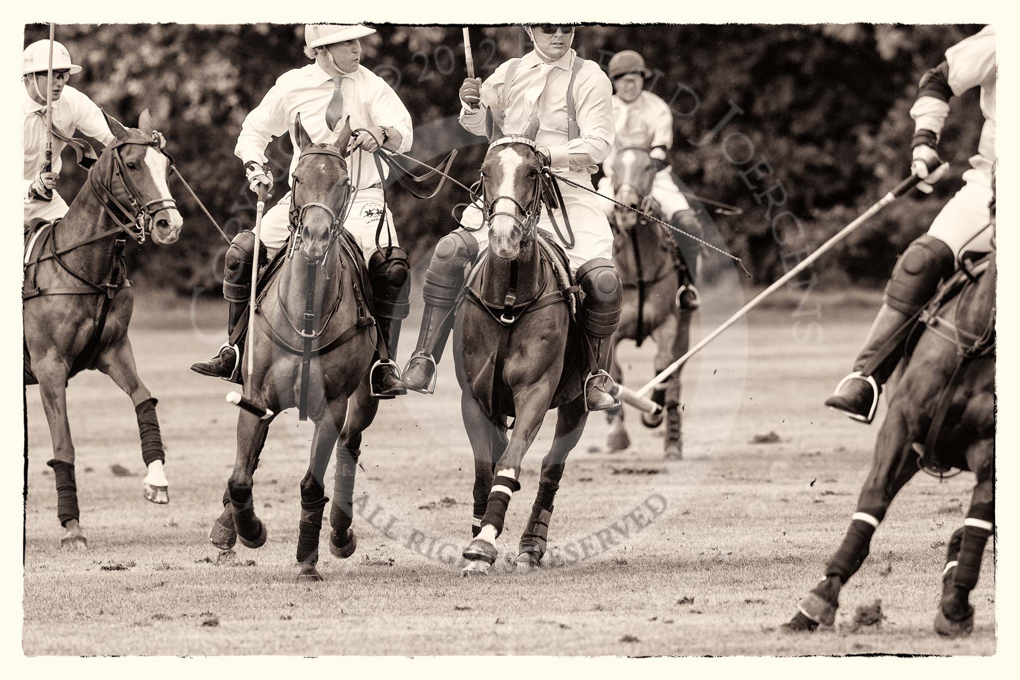 7th Heritage Polo Cup semi-finals: Paul Oberschneider La Golondrina riding along side Timothy Rose La Mariposa..
Hurtwood Park Polo Club,
Ewhurst Green,
Surrey,
United Kingdom,
on 04 August 2012 at 15:56, image #302