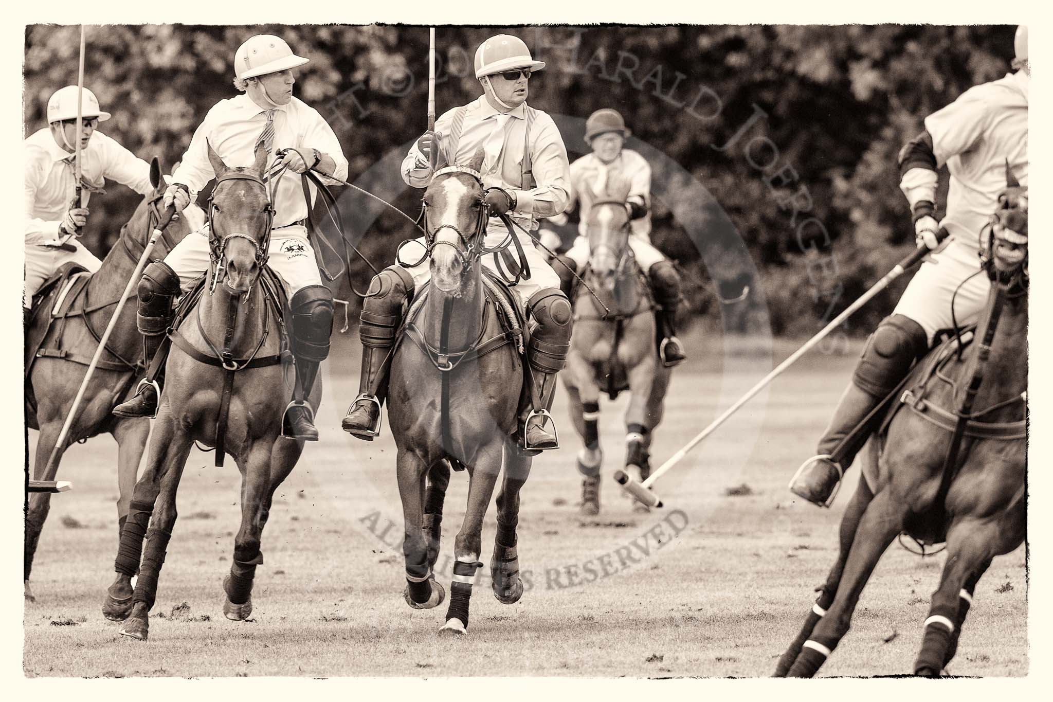 7th Heritage Polo Cup semi-finals: Paul Oberschneider La Golondrina riding along side Timothy Rose La Mariposa..
Hurtwood Park Polo Club,
Ewhurst Green,
Surrey,
United Kingdom,
on 04 August 2012 at 15:56, image #303