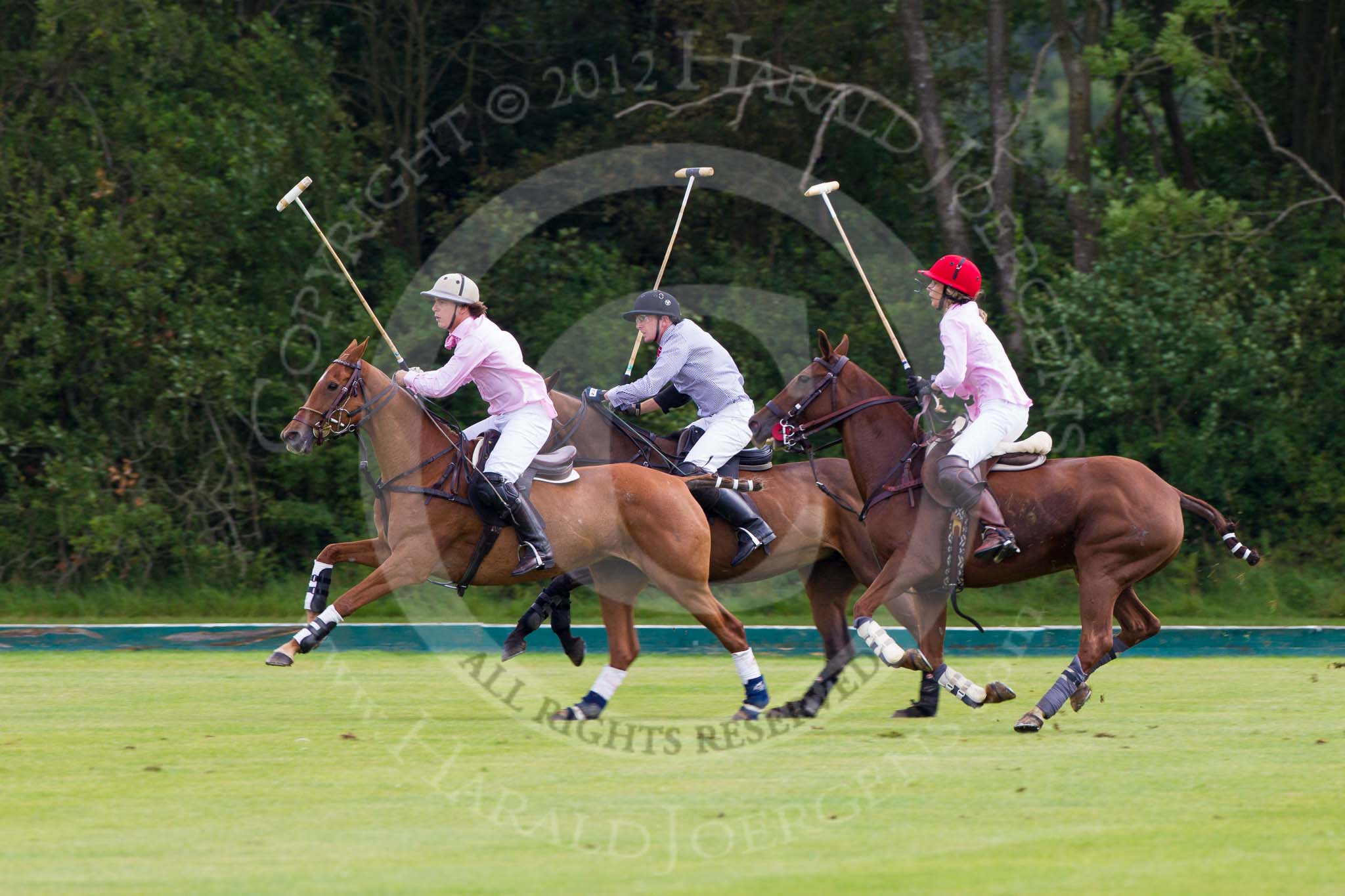 7th Heritage Polo Cup semi-finals: Nico Talamoni and Clare Payne, Team Emerging Switzerland, towards goal..
Hurtwood Park Polo Club,
Ewhurst Green,
Surrey,
United Kingdom,
on 04 August 2012 at 11:10, image #18