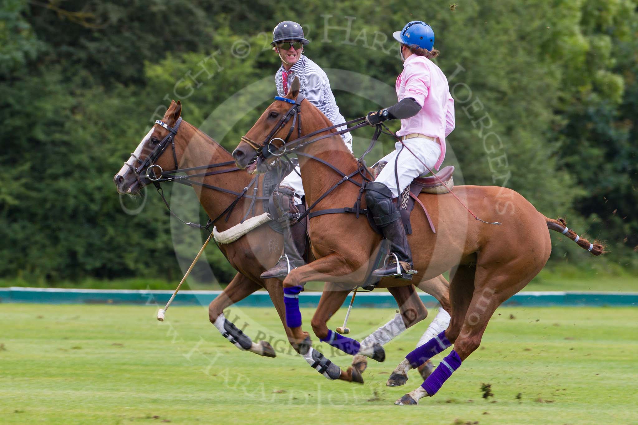 7th Heritage Polo Cup semi-finals: Henry Fisher, Team Silver Fox USA, after play talking to Justo Saveedra, Team Emerging Switzerland..
Hurtwood Park Polo Club,
Ewhurst Green,
Surrey,
United Kingdom,
on 04 August 2012 at 11:33, image #57