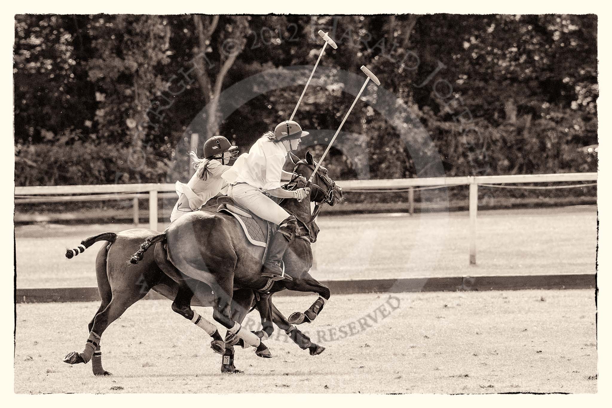 7th Heritage Polo Cup finals: Brownie Taylor being ridden off by Clare Payne..
Hurtwood Park Polo Club,
Ewhurst Green,
Surrey,
United Kingdom,
on 05 August 2012 at 15:40, image #185