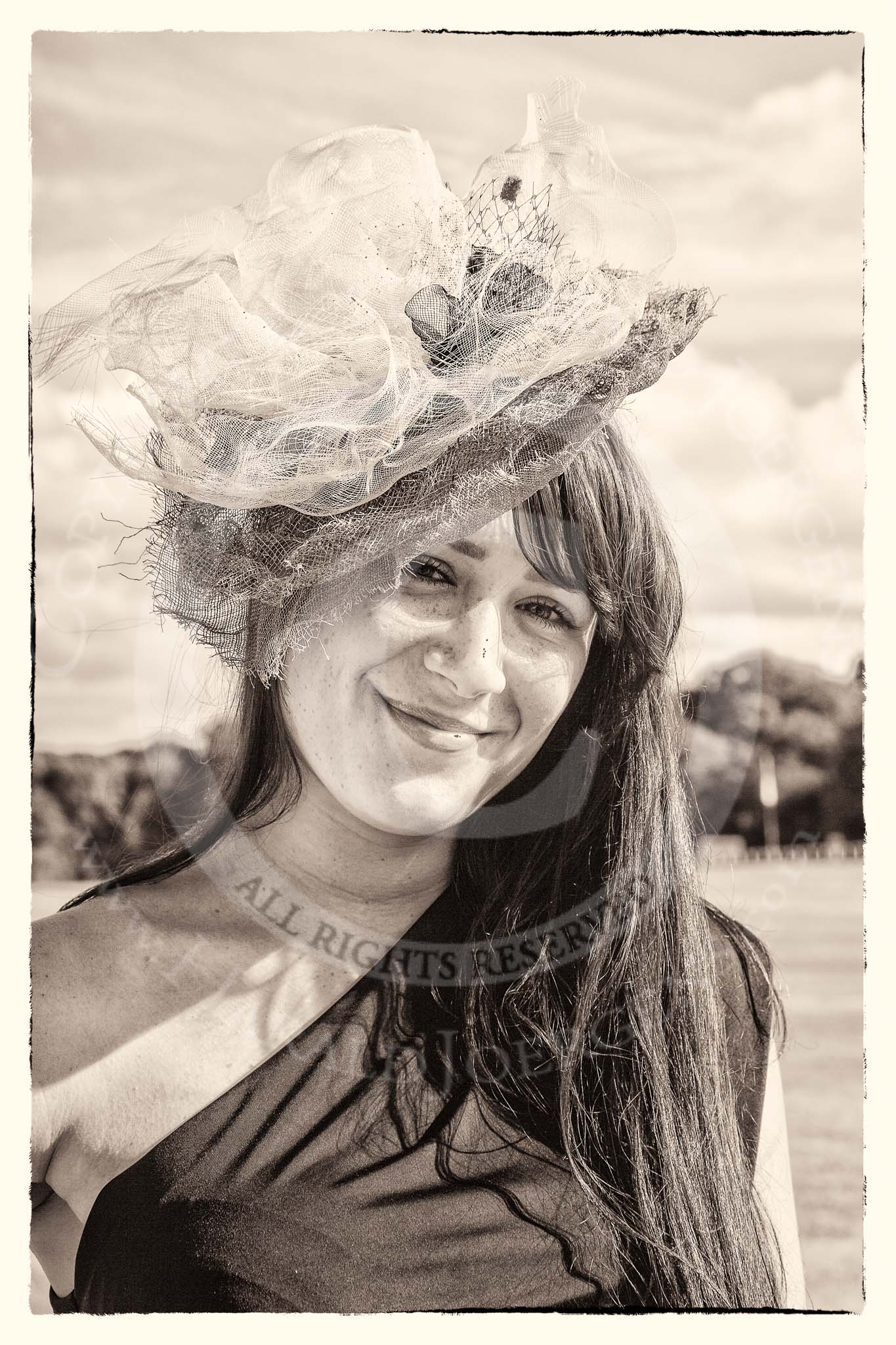 7th Heritage Polo Cup finals: Annabel Cattlin wearing one of her mother's Millinery Creations 2012..
Hurtwood Park Polo Club,
Ewhurst Green,
Surrey,
United Kingdom,
on 05 August 2012 at 16:48, image #229