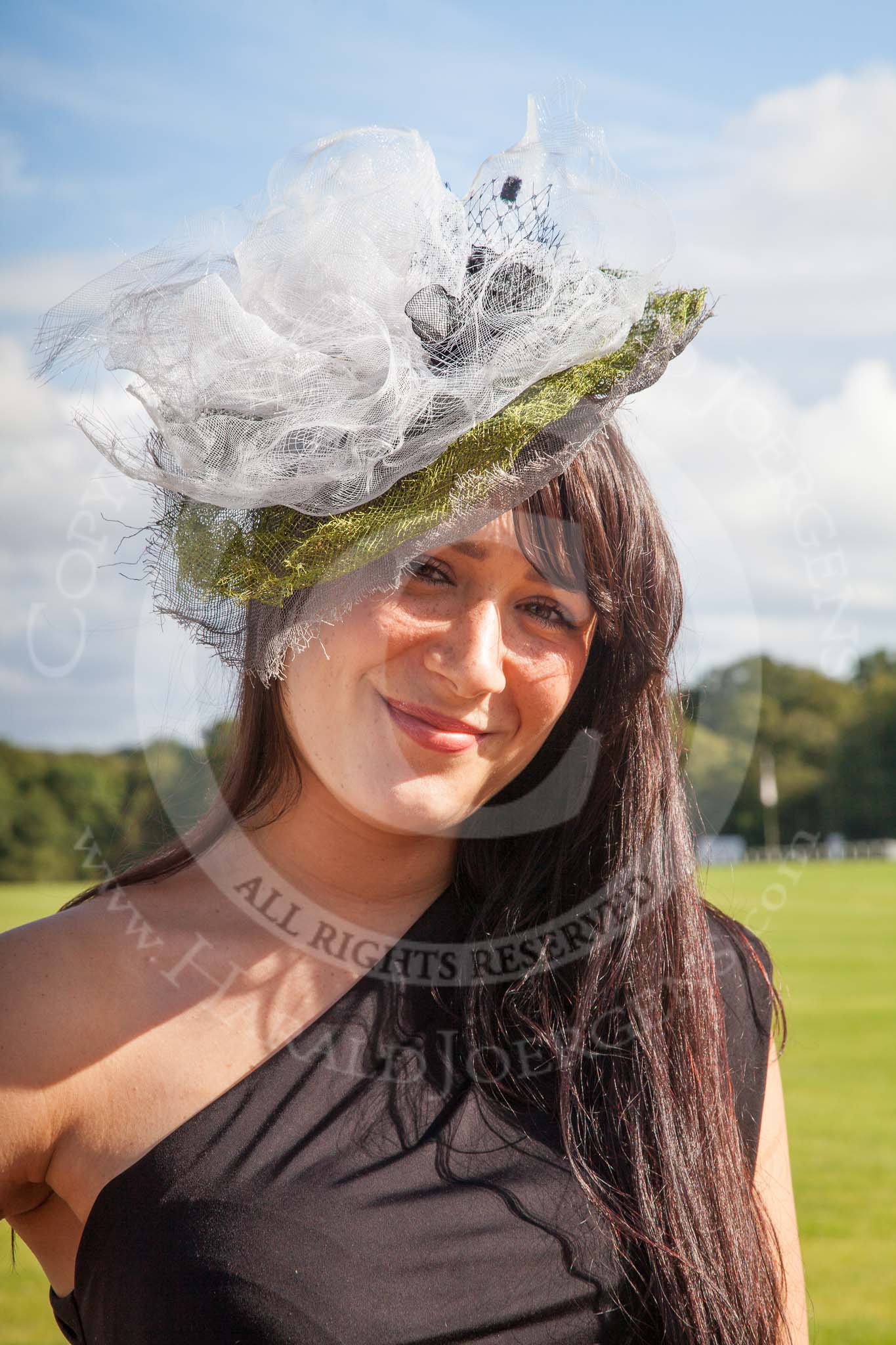 7th Heritage Polo Cup finals: Annabel Cattlin wearing one of her mother's Millinery Creations 2012..
Hurtwood Park Polo Club,
Ewhurst Green,
Surrey,
United Kingdom,
on 05 August 2012 at 16:48, image #229