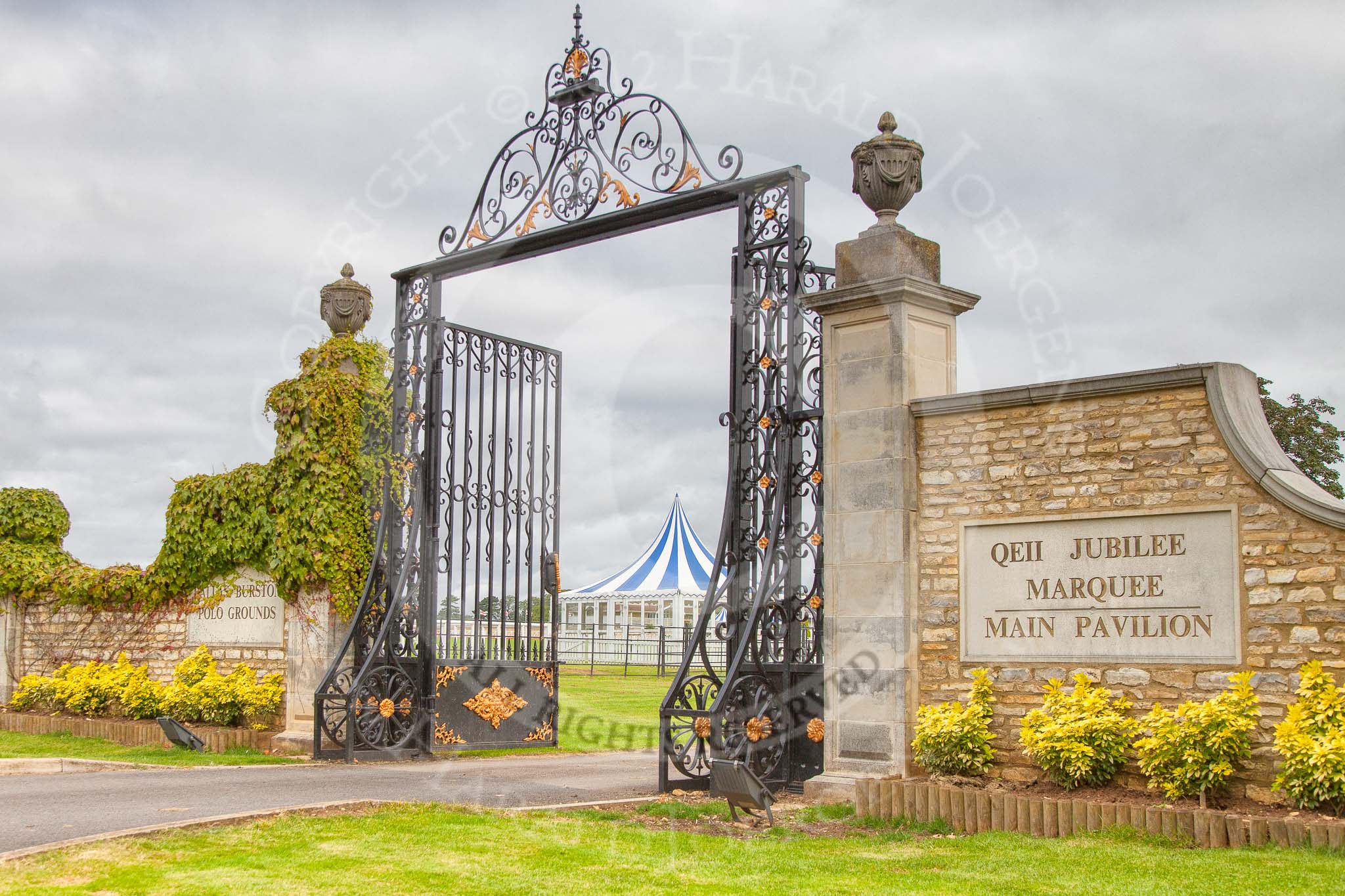 DBPC Polo in the Park 2012: The Eastern entrance to the Dallas Burston Polo Grounds and the QEII Jubilee Marquee..
Dallas Burston Polo Club,
Stoneythorpe Estate,
Southam,
Warwickshire,
United Kingdom,
on 16 September 2012 at 08:54, image #5