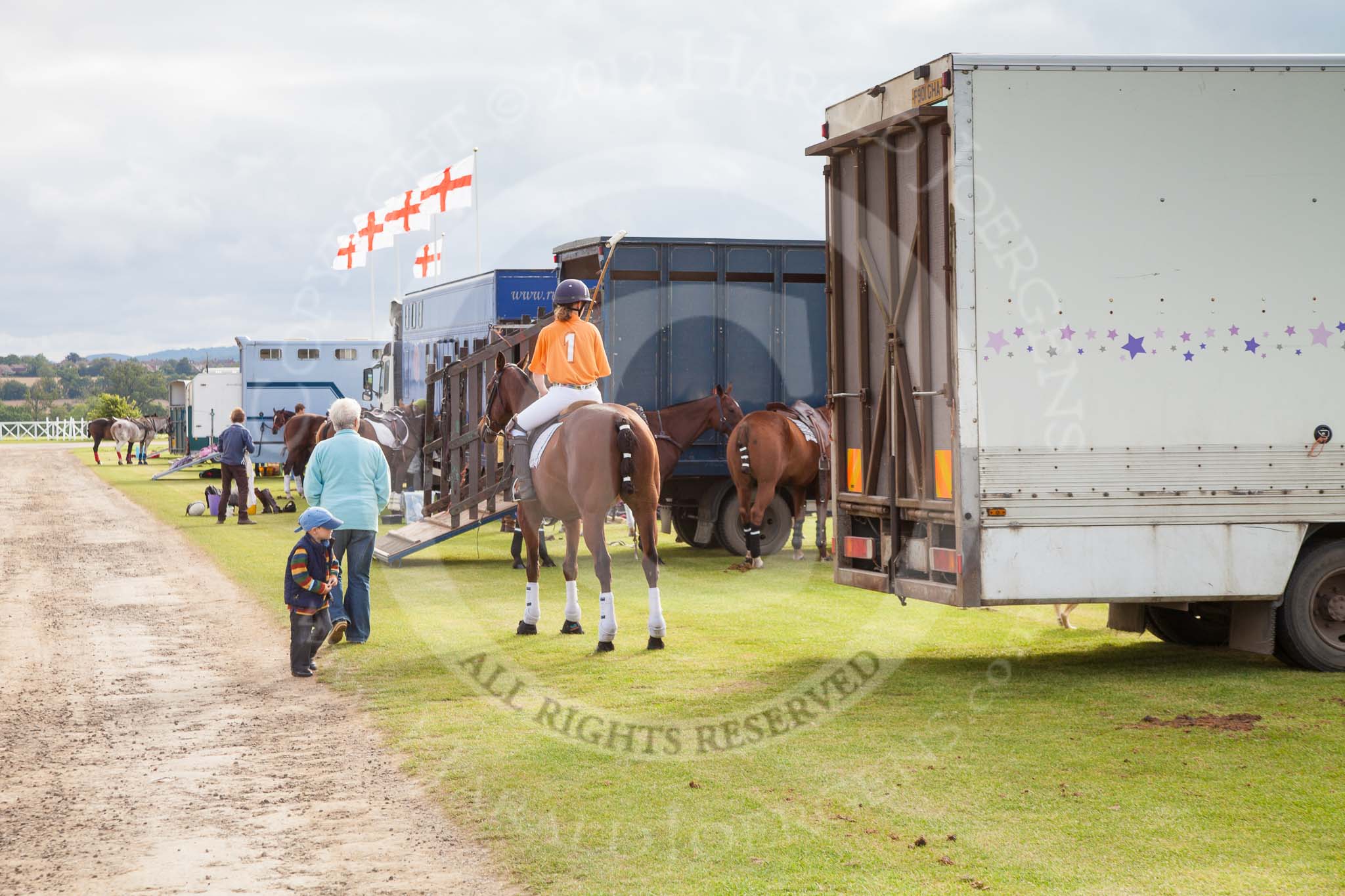 DBPC Polo in the Park 2012: The pony line along the Silver Pitch. Already on horseback - No. 1 of the Kangaroos, Jane Kang..
Dallas Burston Polo Club,
Stoneythorpe Estate,
Southam,
Warwickshire,
United Kingdom,
on 16 September 2012 at 09:52, image #17