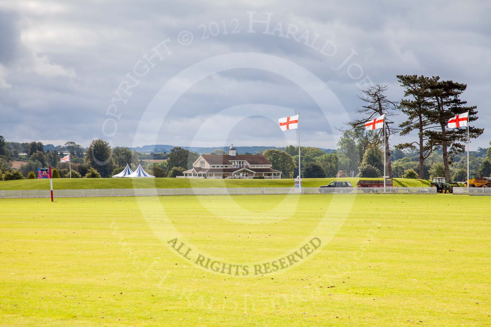 DBPC Polo in the Park 2012: The clubhouse of Dallas Burston Polo Club seen from the Silver Pitch - in the background left a bouncy castle, part of the fun fair..
Dallas Burston Polo Club,
Stoneythorpe Estate,
Southam,
Warwickshire,
United Kingdom,
on 16 September 2012 at 09:53, image #18