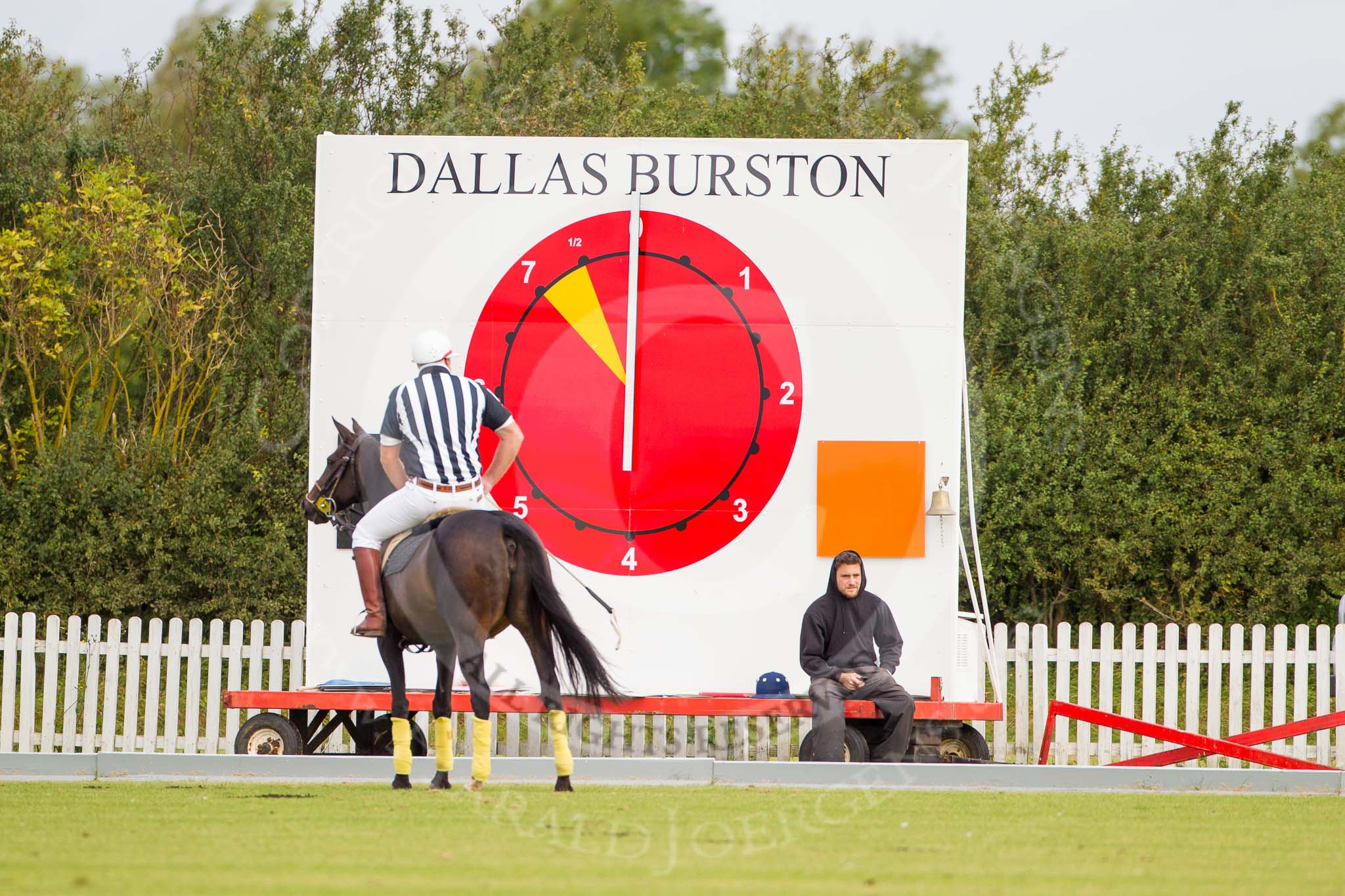 DBPC Polo in the Park 2012: The time- and results board at the Silver Pitch, umpire Ian 'Ginger' Hunt checking everything is readty for the first match..
Dallas Burston Polo Club,
Stoneythorpe Estate,
Southam,
Warwickshire,
United Kingdom,
on 16 September 2012 at 10:02, image #25