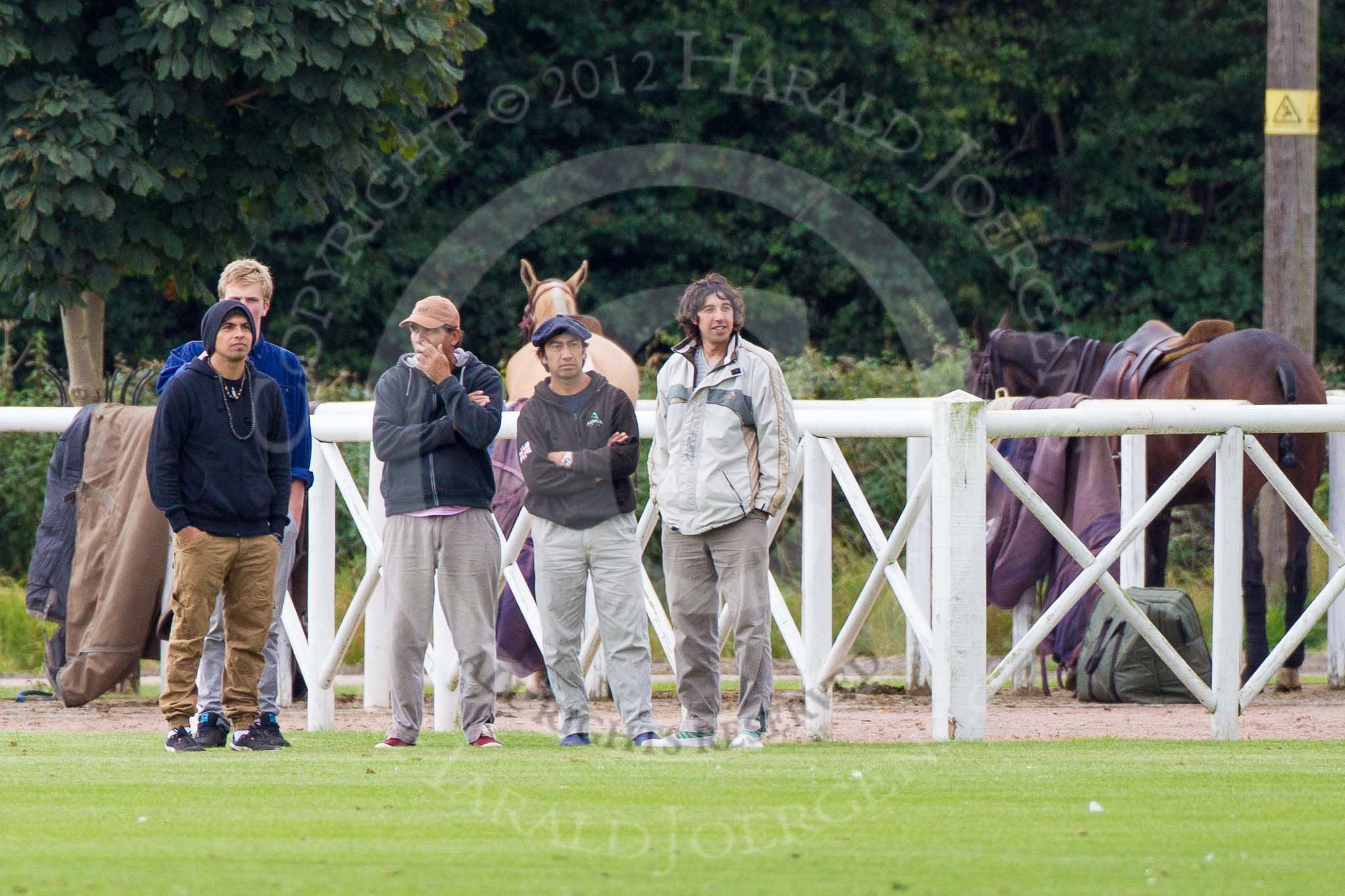 DBPC Polo in the Park 2012: Grooms watching the match JCS v Rated People..
Dallas Burston Polo Club,
Stoneythorpe Estate,
Southam,
Warwickshire,
United Kingdom,
on 16 September 2012 at 11:01, image #65