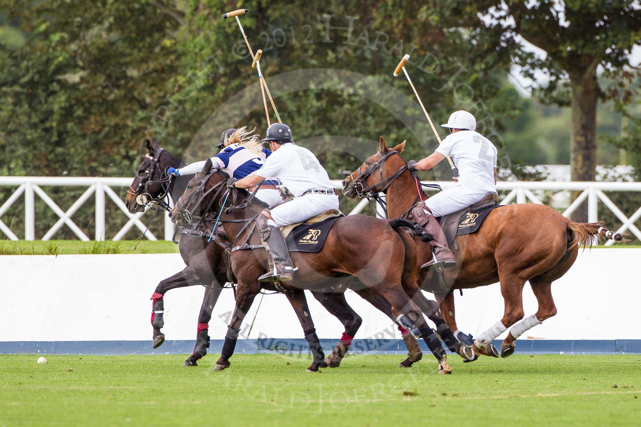 DBPC Polo in the Park 2012: Rated People Polo Team #4, Johnny Moreland-Lynn, and #2, Tariq Dag Khan, v JCS #3, Emma Nicolson..
Dallas Burston Polo Club,
Stoneythorpe Estate,
Southam,
Warwickshire,
United Kingdom,
on 16 September 2012 at 11:13, image #72