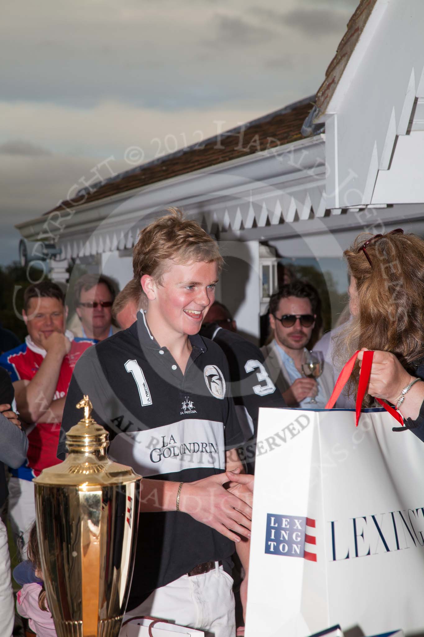 DBPC Polo in the Park 2012: Paul Oberschneider, patron of the La Golondrina polo team that won the  Dallas Burston Gold Cup Tournament, with #1 player Hugo Davis..
Dallas Burston Polo Club,
Stoneythorpe Estate,
Southam,
Warwickshire,
United Kingdom,
on 16 September 2012 at 18:11, image #311