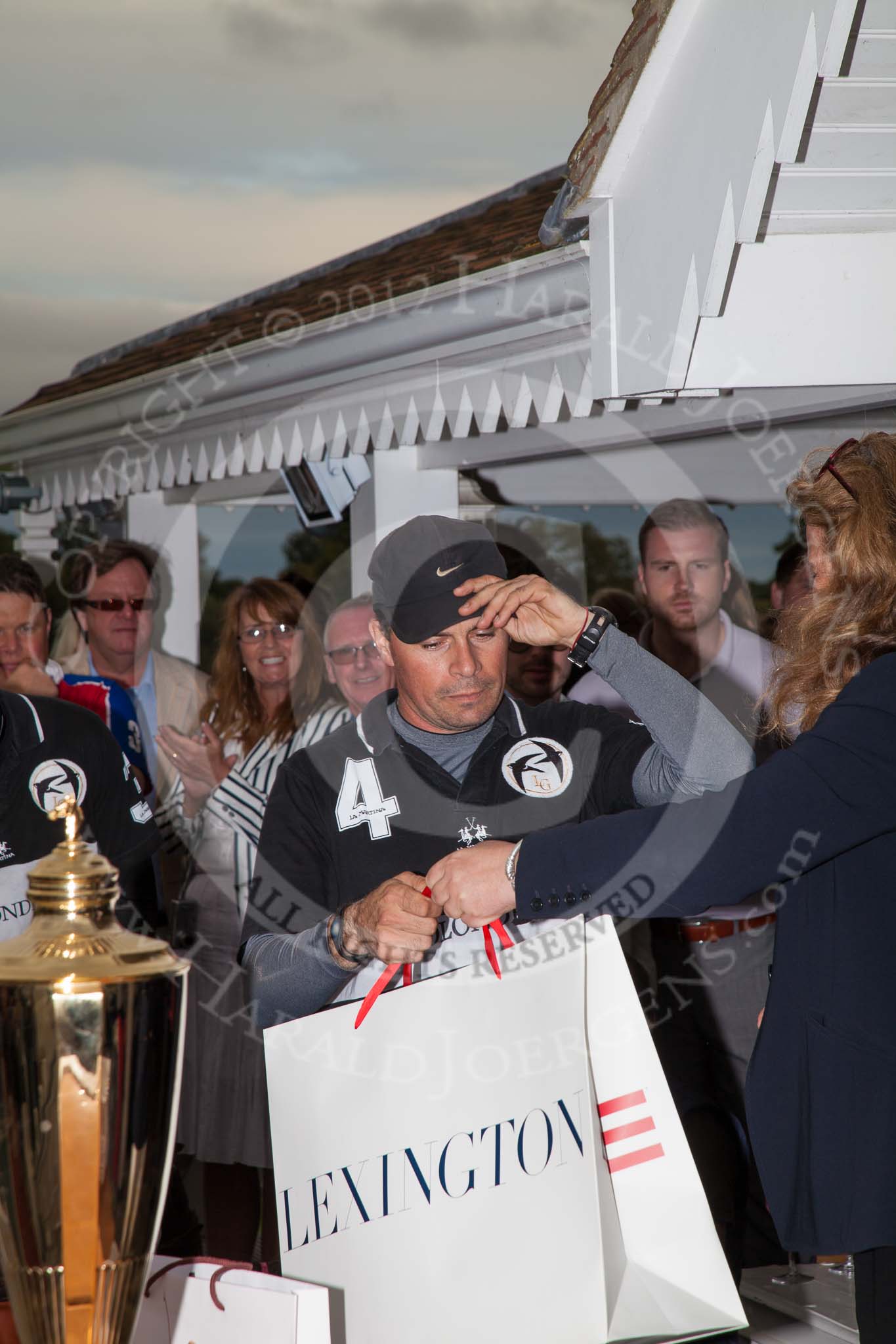 DBPC Polo in the Park 2012: HRH Princess Katarina of Yugoslavia giving the prices to the La Golondrina polo team that won the  Dallas Burston Gold Cup Tournament, with #4 player Matias Carrique..
Dallas Burston Polo Club,
Stoneythorpe Estate,
Southam,
Warwickshire,
United Kingdom,
on 16 September 2012 at 18:11, image #312