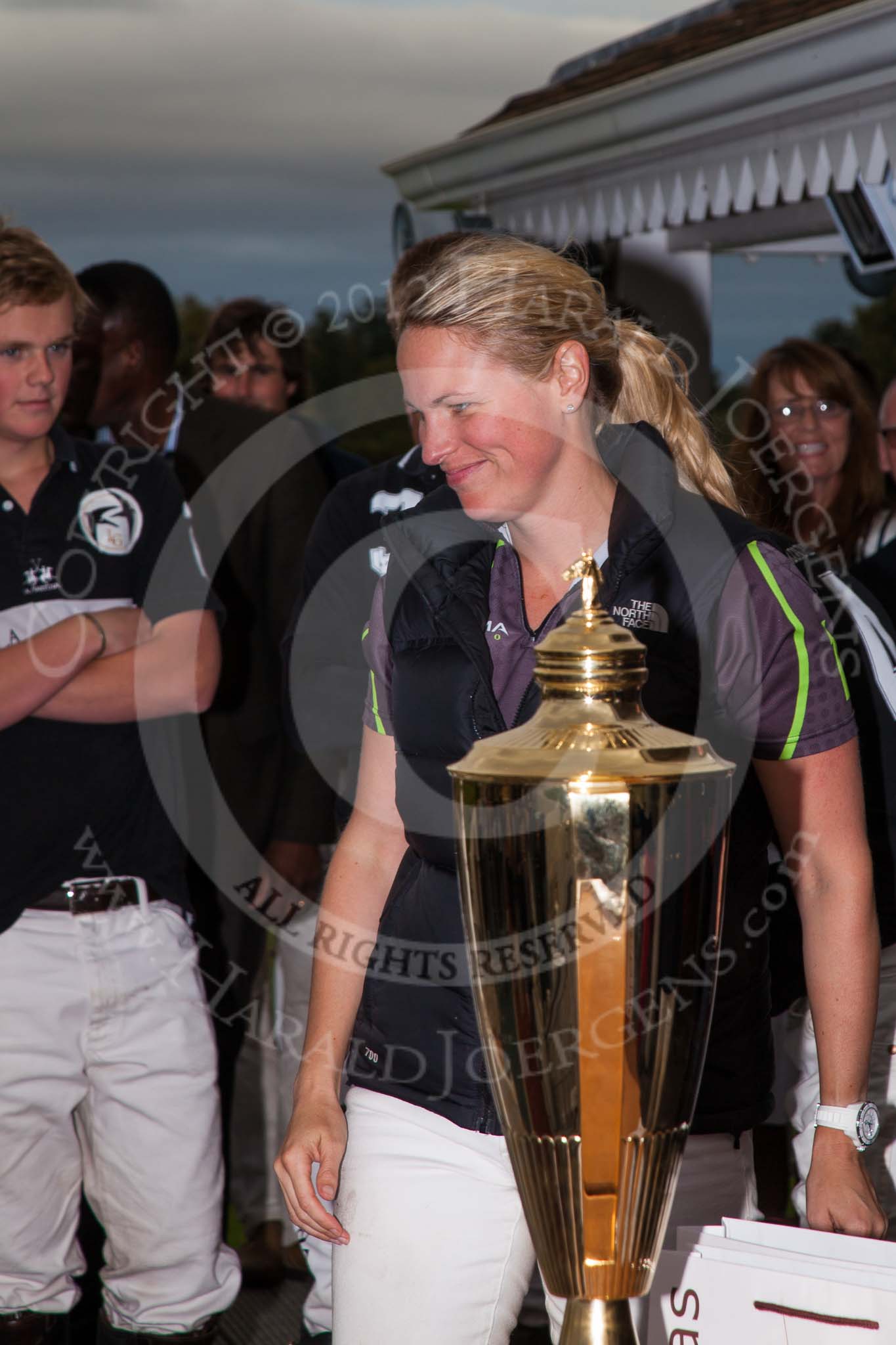 DBPC Polo in the Park 2012: Runner-up for the Dallas Burston Gold Cup Tournament was the team Rigby & Rigby. Here: Jenny Rigby, behind her the winning La Golondrina team..
Dallas Burston Polo Club,
Stoneythorpe Estate,
Southam,
Warwickshire,
United Kingdom,
on 16 September 2012 at 18:12, image #314